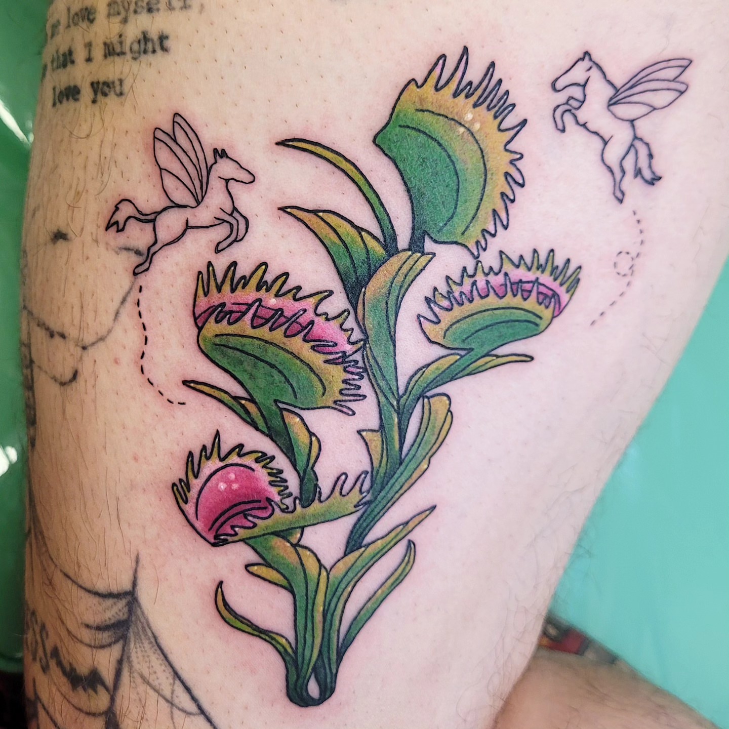 Venus flytrap American traditional tattoo on the thigh by Wray Saulsberry