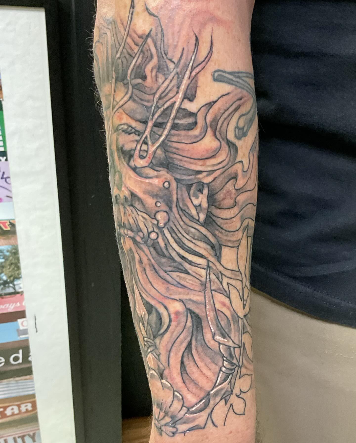Demon dark realism tattoo on the forearm by Roachrude