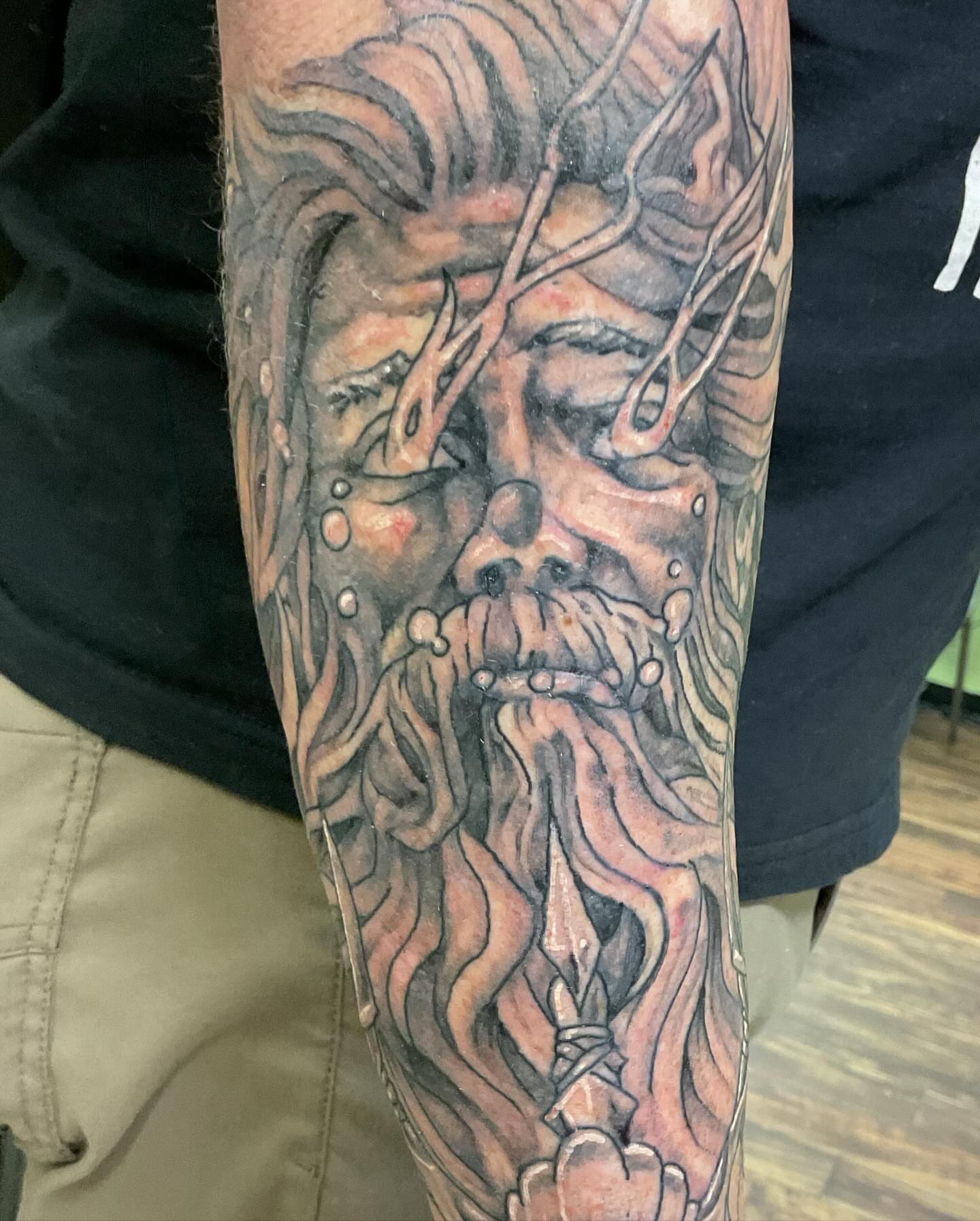 Tree-like face dotwork tattoo on the forearm by Roachrude