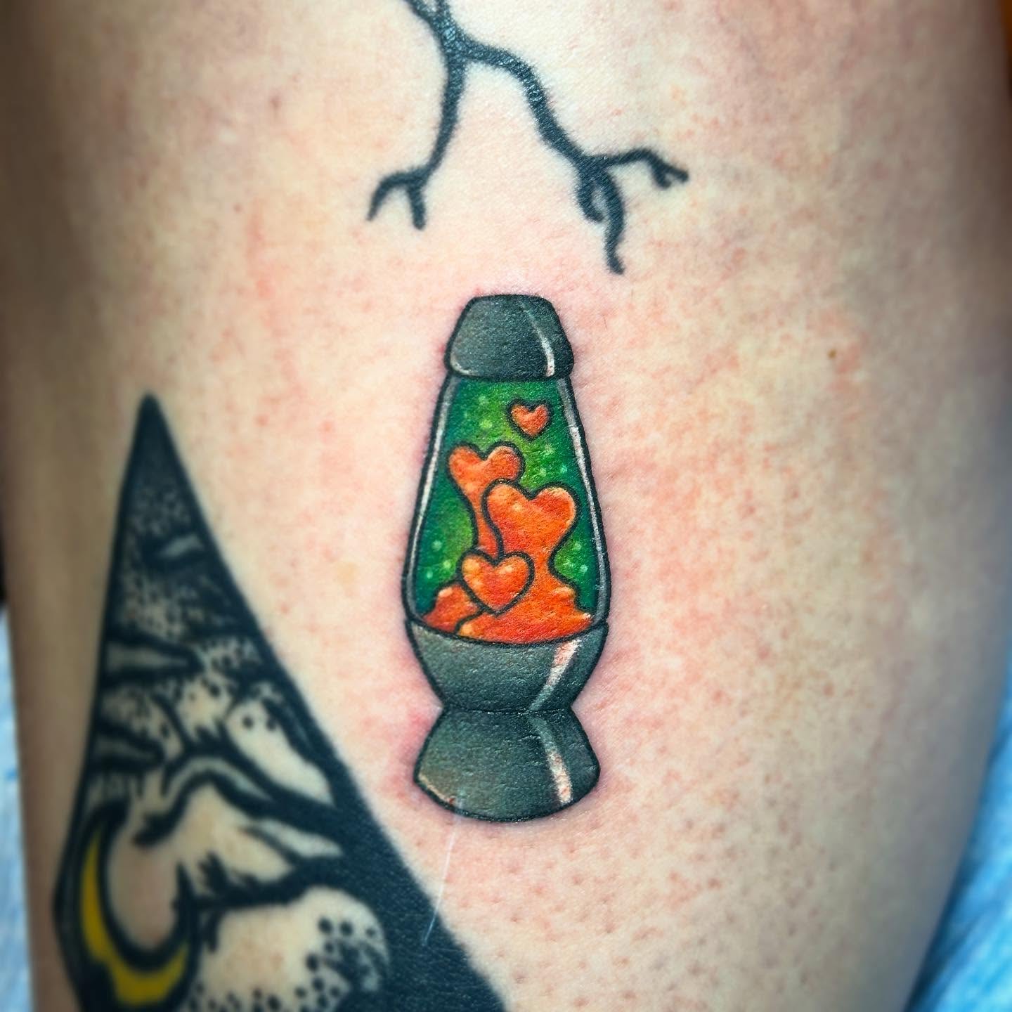 Lava lamp new school tattoo on the thigh by Holle Hellfire