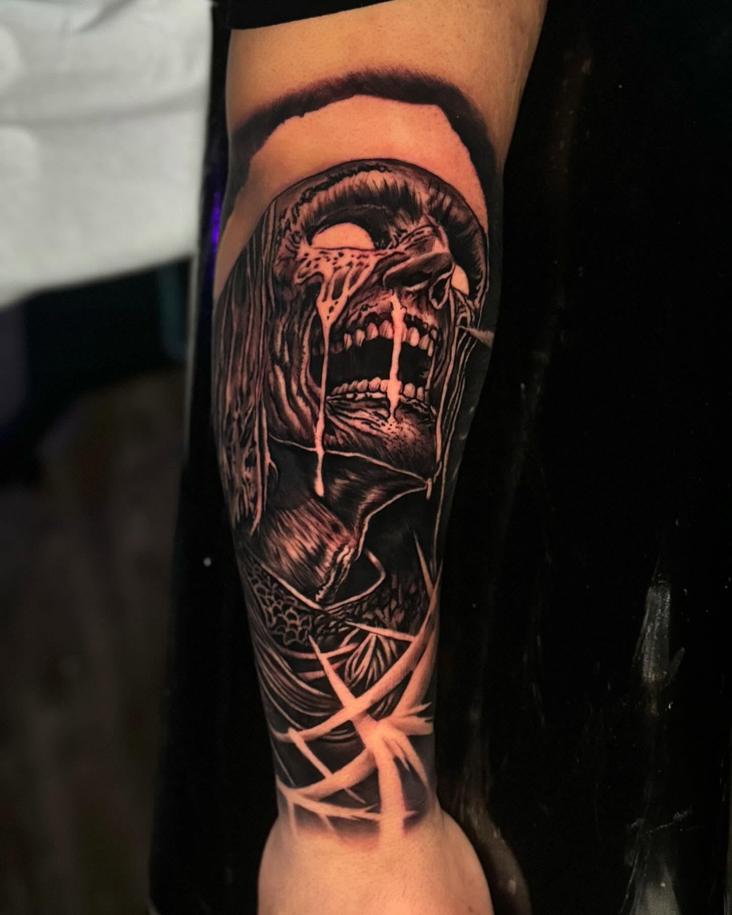 Horror creature dark realism tattoo on the forearm by Jose Mendoza Torres