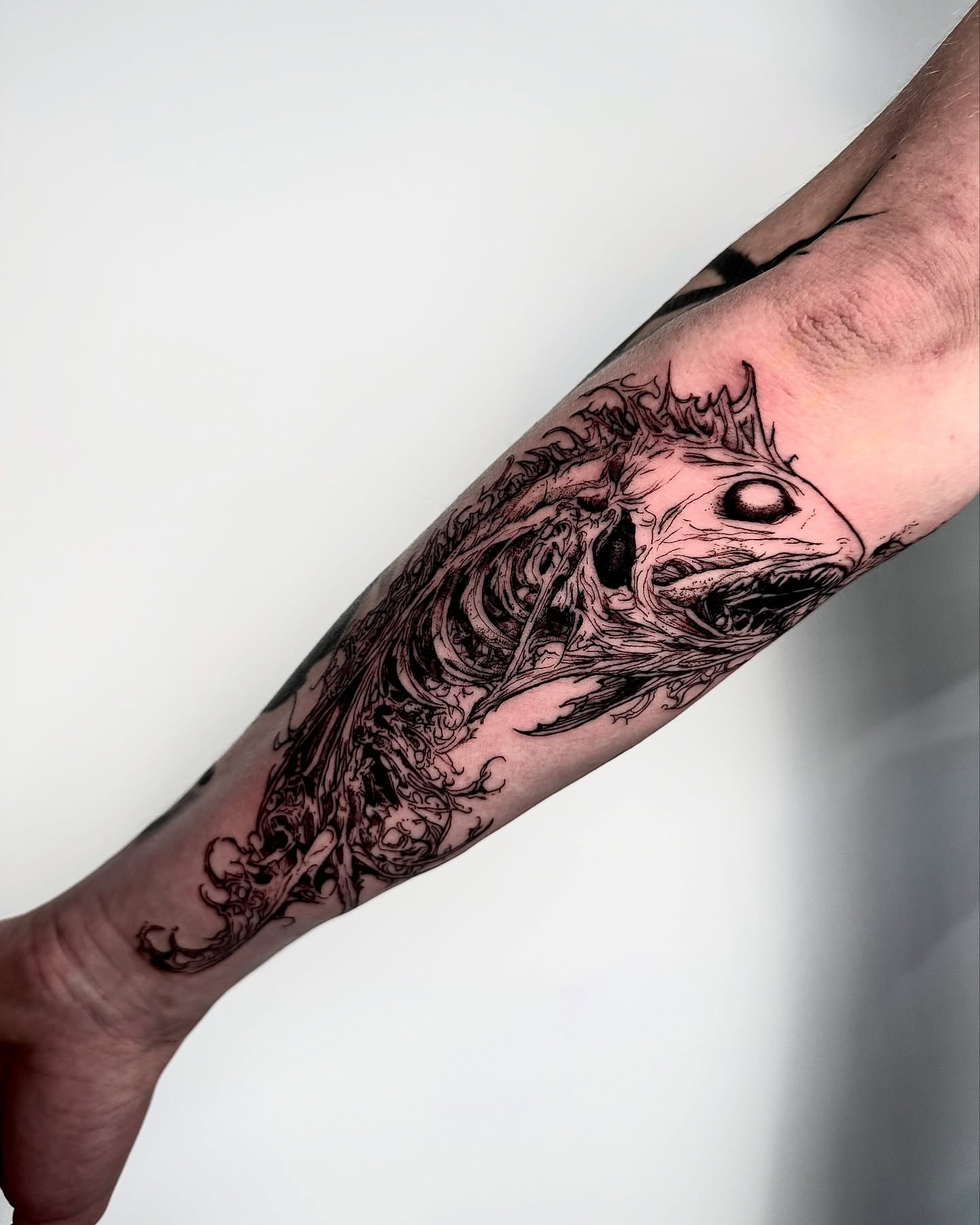 Monster black and grey tattoo on the forearm by Bwk Dark Art