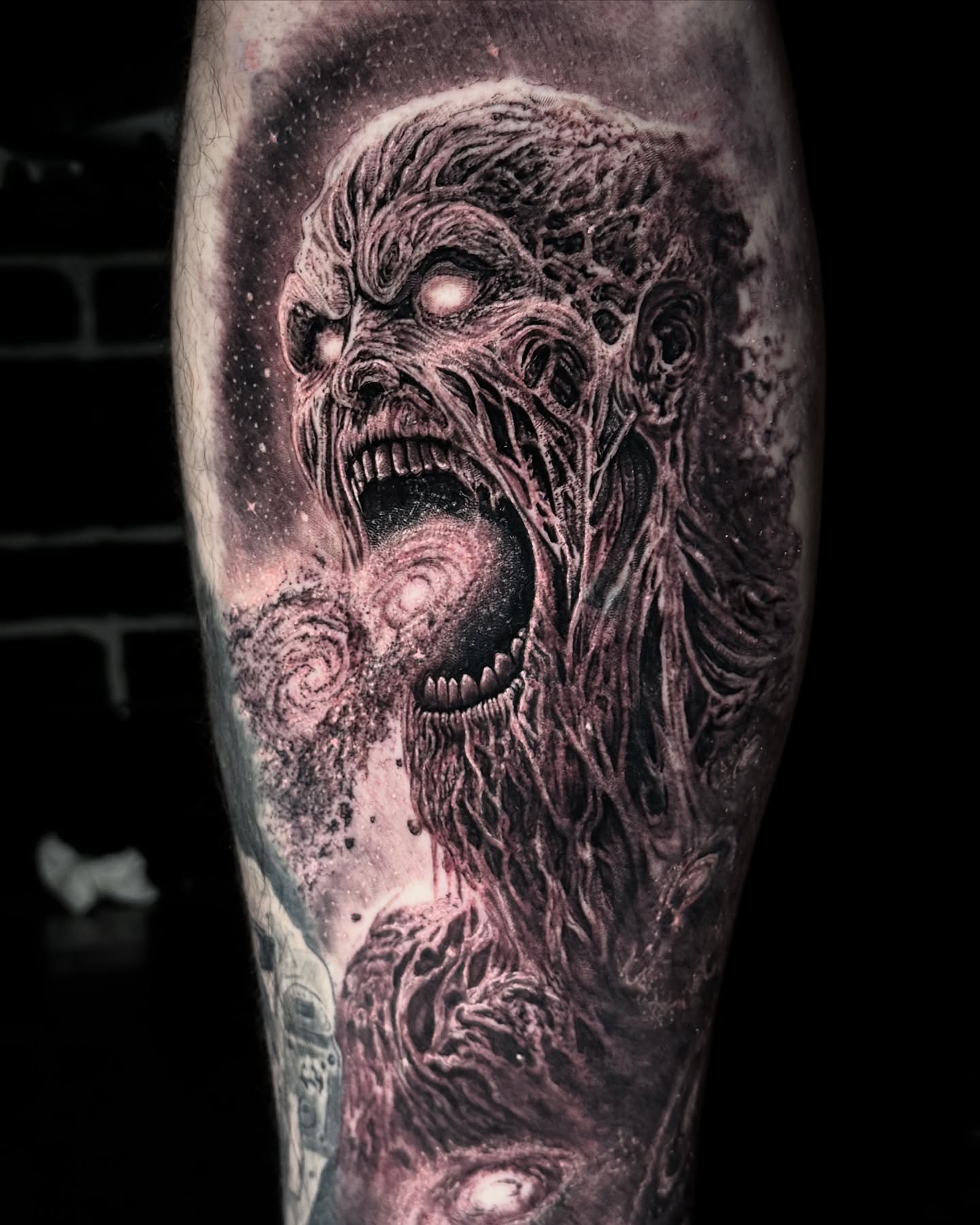 Horror creature dark realism tattoo on the forearm by Maverick Mayes🕷