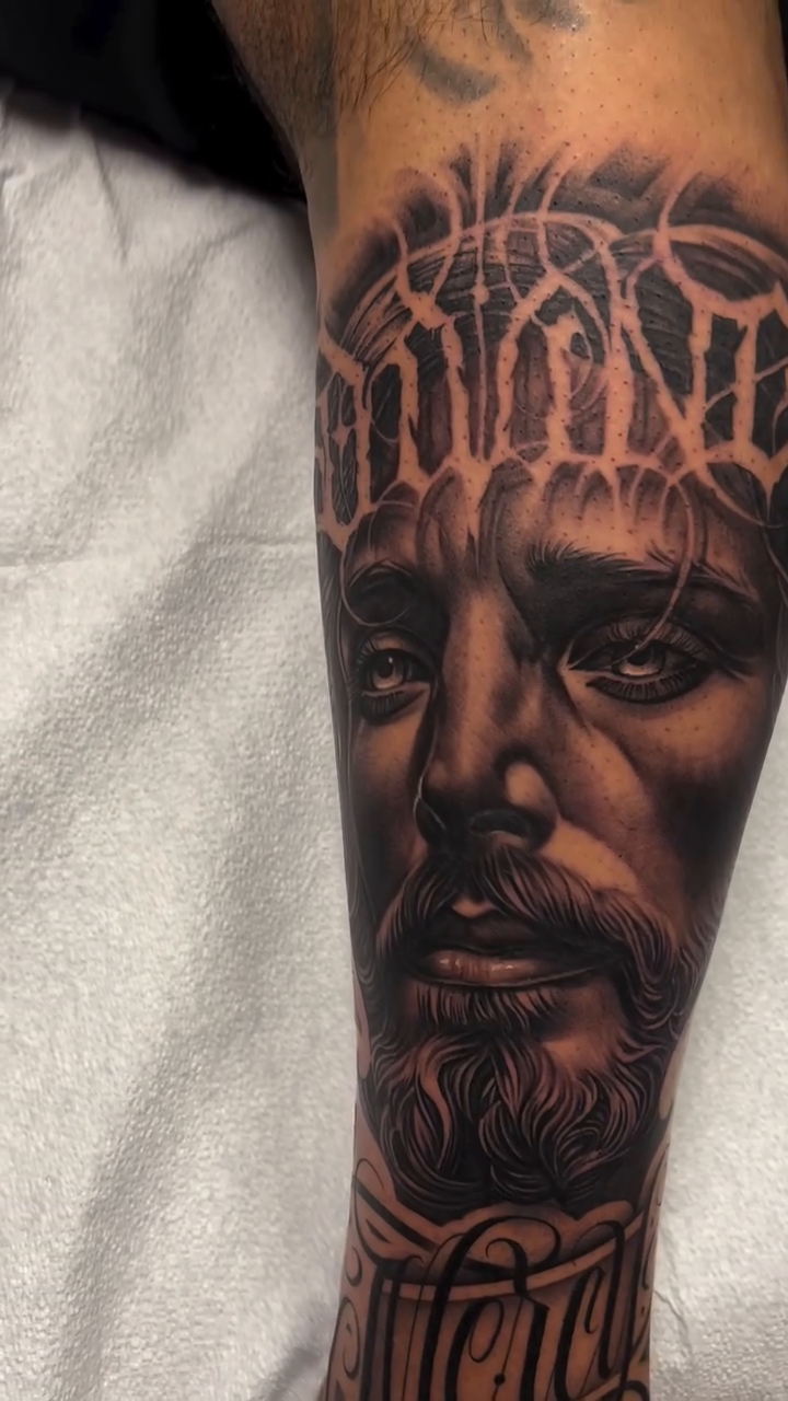 Jesus portrait with script realism tattoo by Antonio Pavić, Los Angeles, California