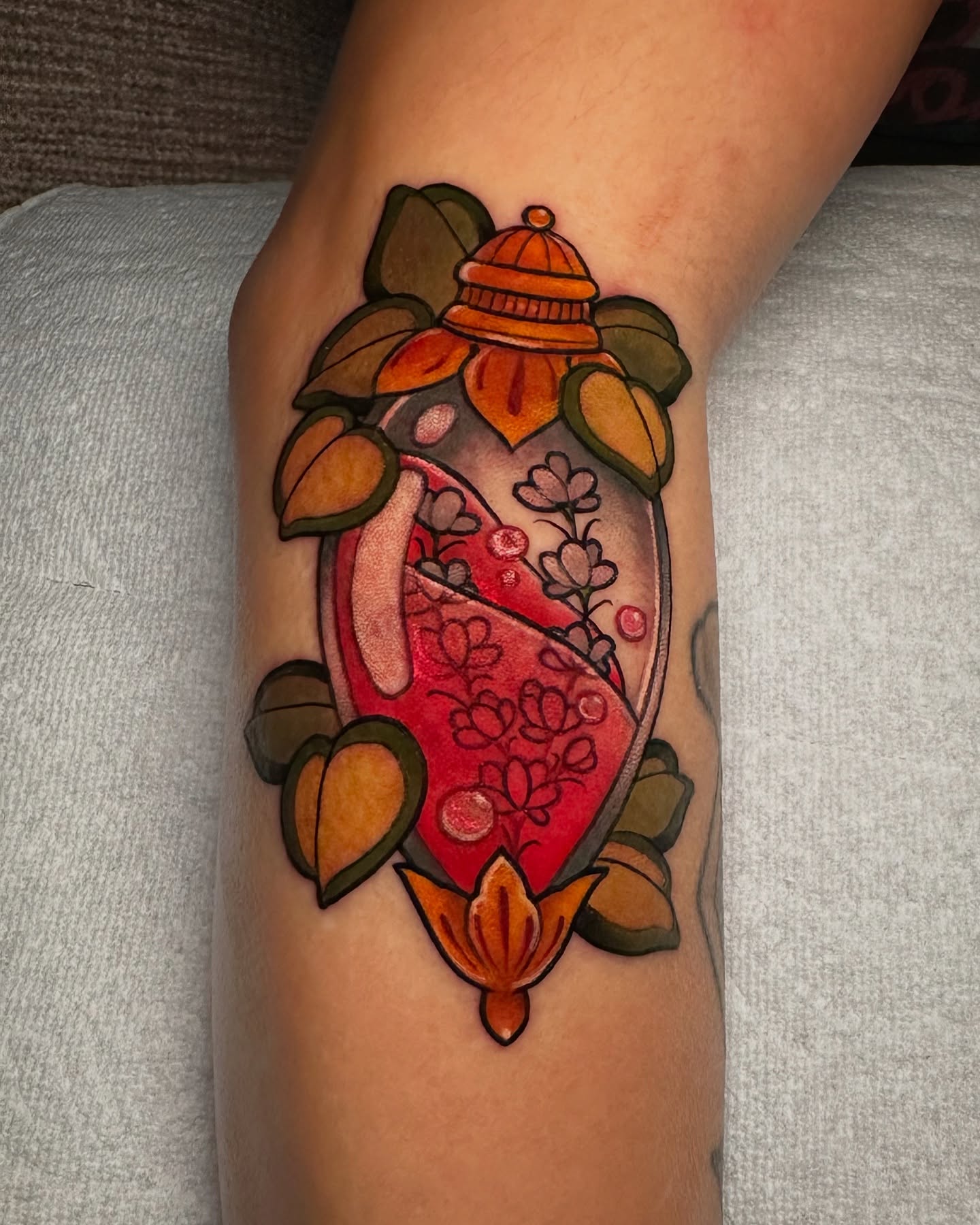 Lamp and floral American traditional tattoo on the forearm by Tayler Pearson, Fort Collins, Colorado