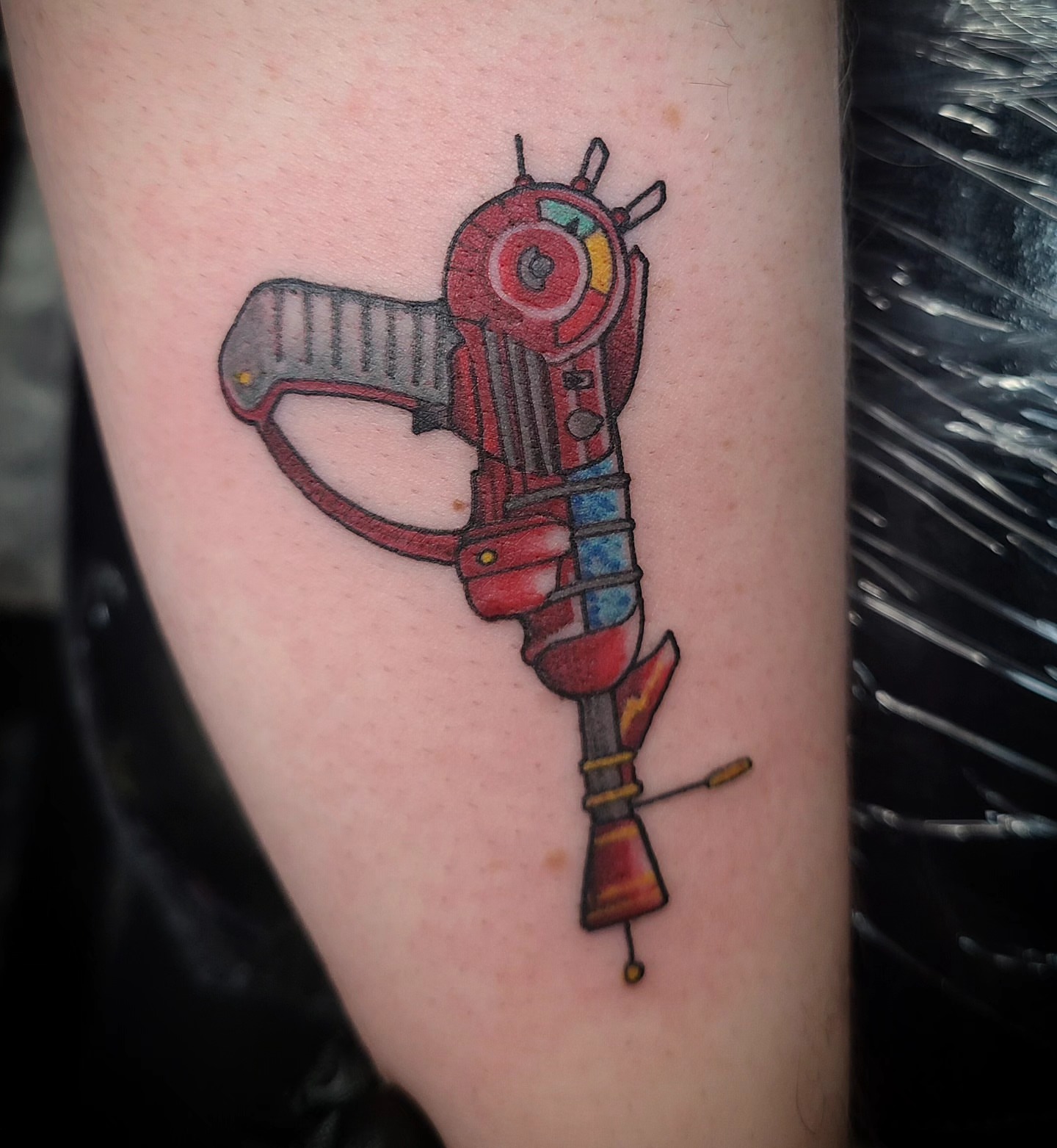 Gun American traditional tattoo on the forearm by David Vodicka