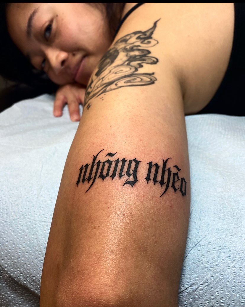 Nhông nhèo lettering script tattoo on the forearm by Alan Pham, San Jose, California