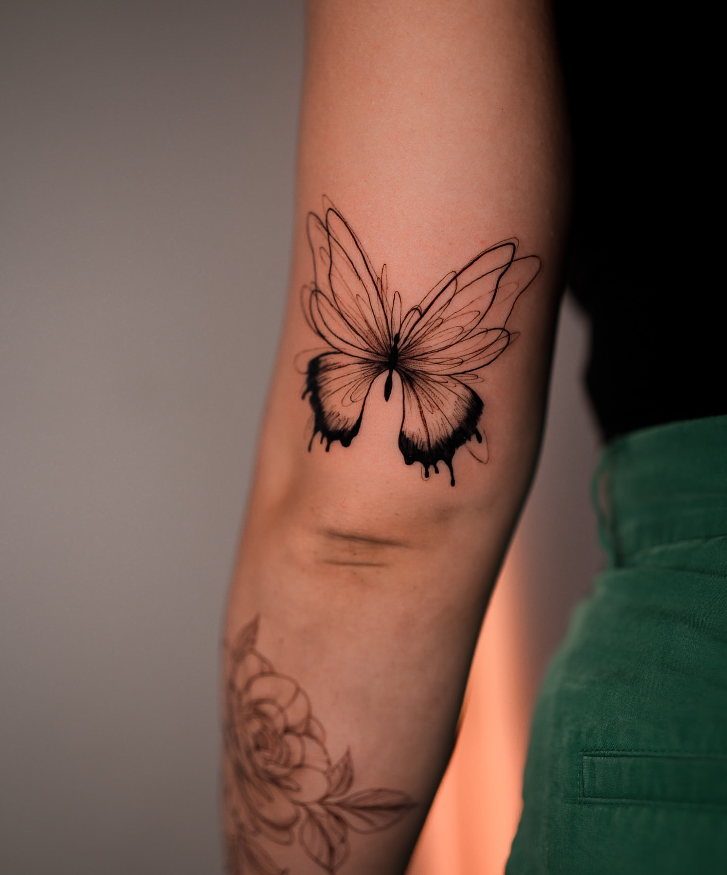 Butterfly black and grey tattoo on the forearm by NYC