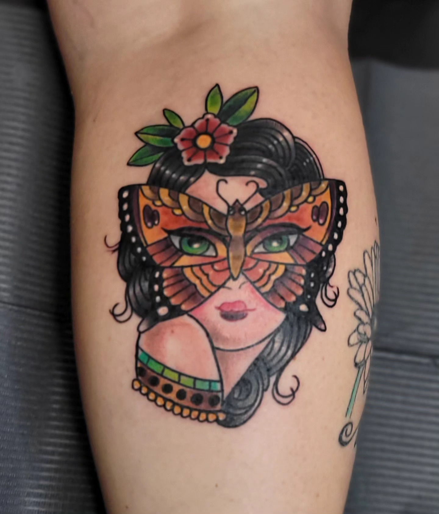 Mask-wearing woman American traditional tattoo on the forearm by Dawne Michele