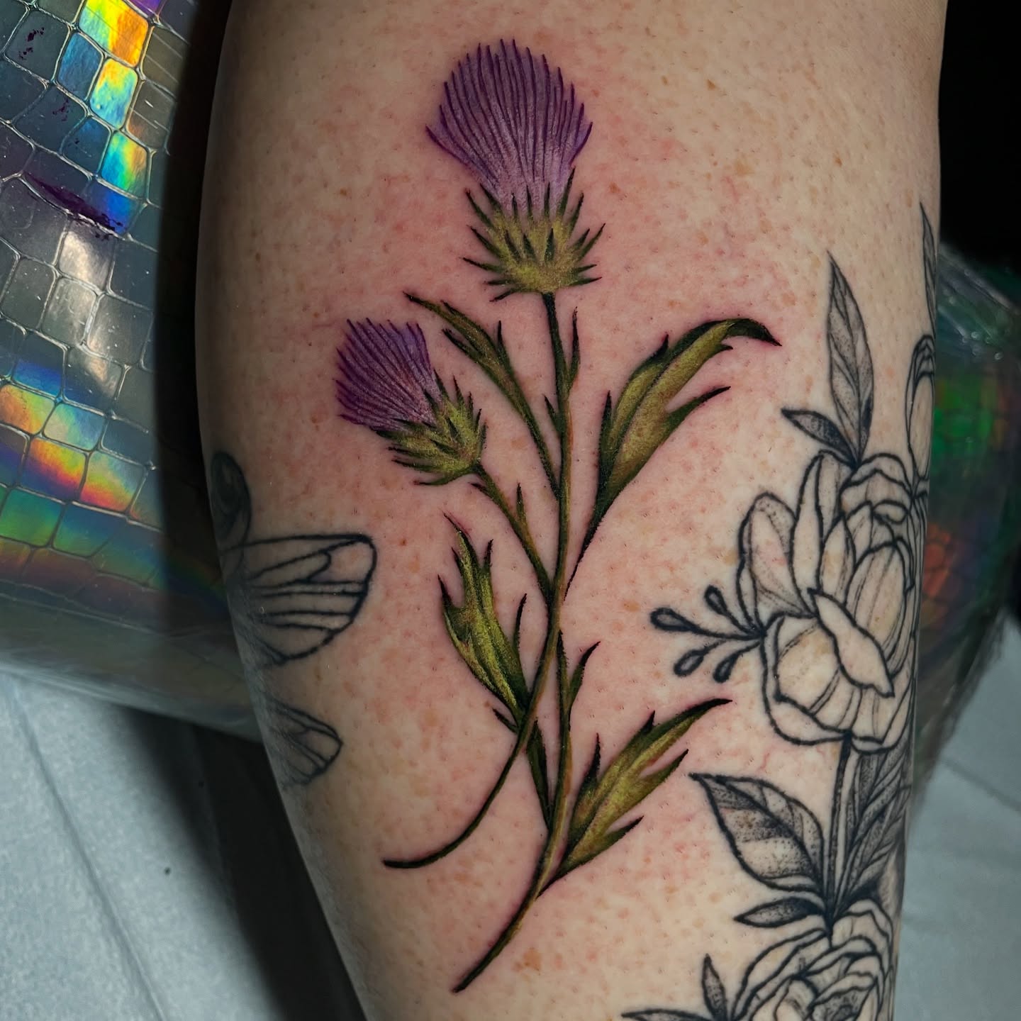 Purple thistle realism tattoo on the forearm by Dayton Tattoo Artist, Miamisburg, Ohio