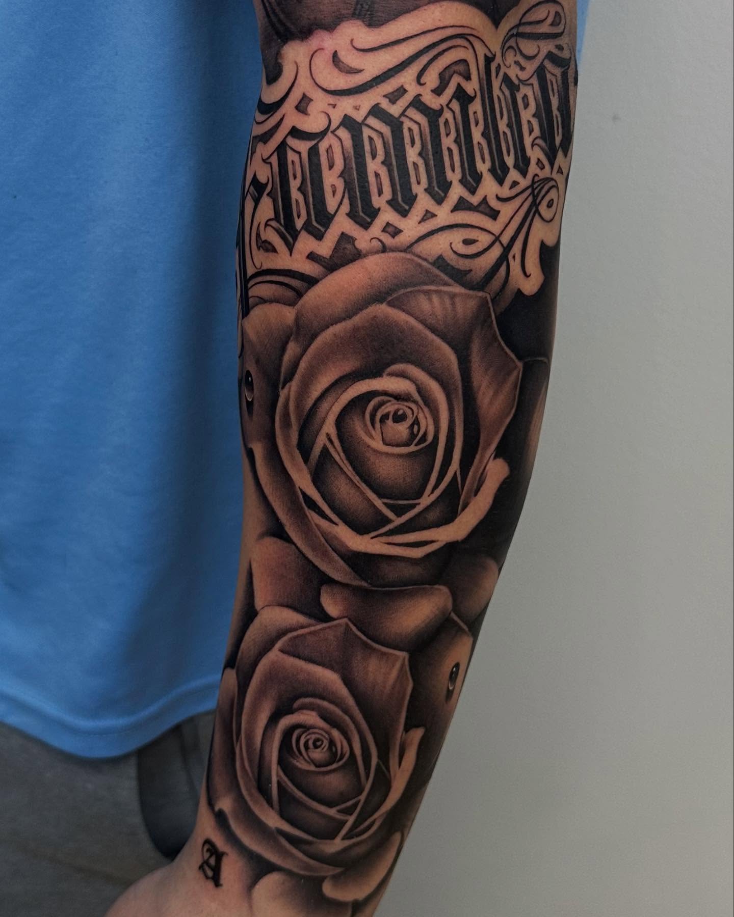 Roses realism tattoo on the forearm by Miguel Saucedo