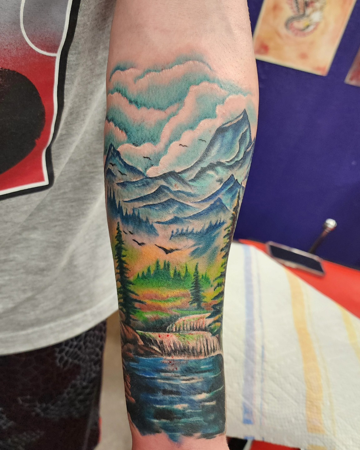 Mountain landscape realism tattoo on the forearm by @thedevilspaintbrush_