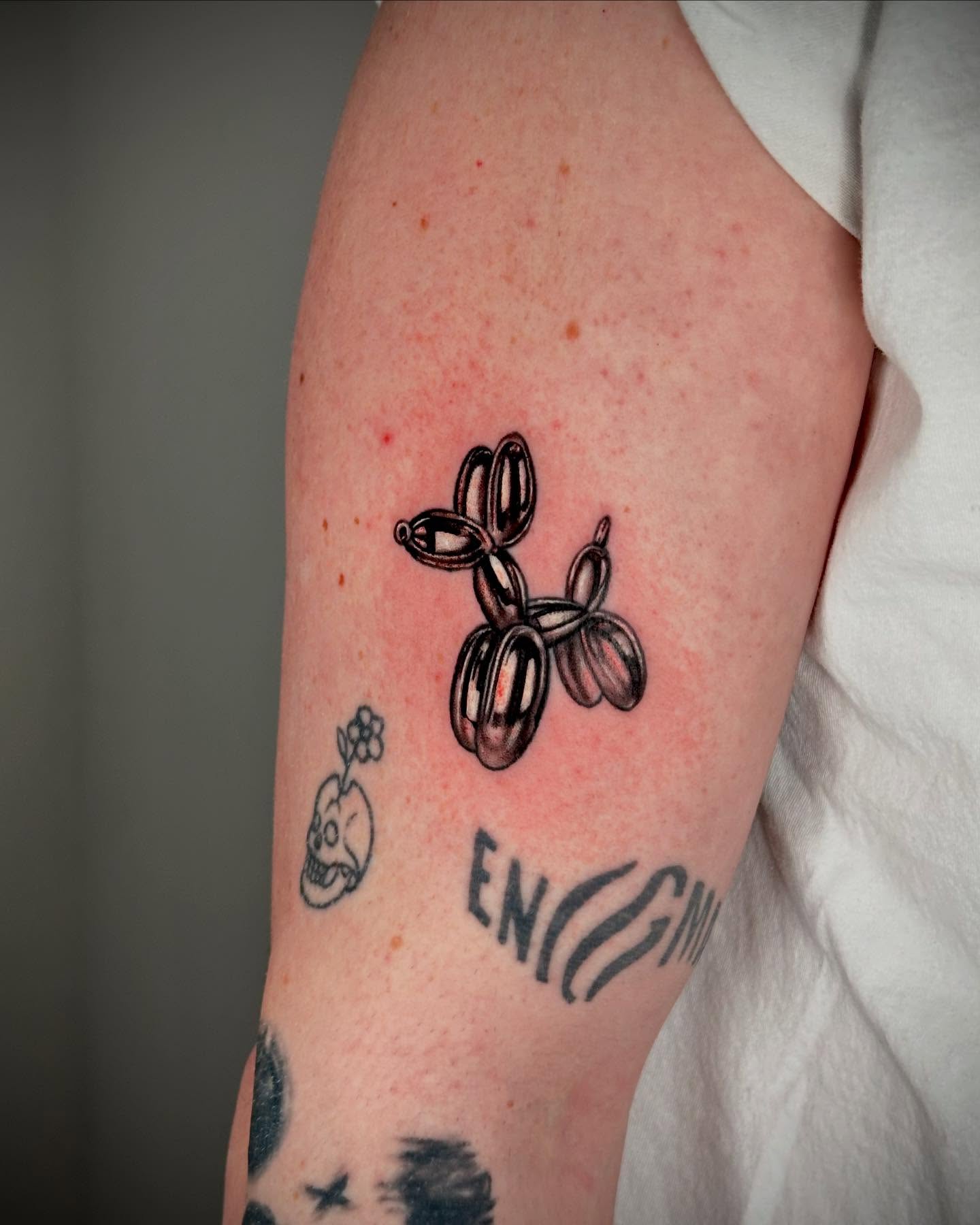Balloon animal black and grey tattoo on the forearm by MR