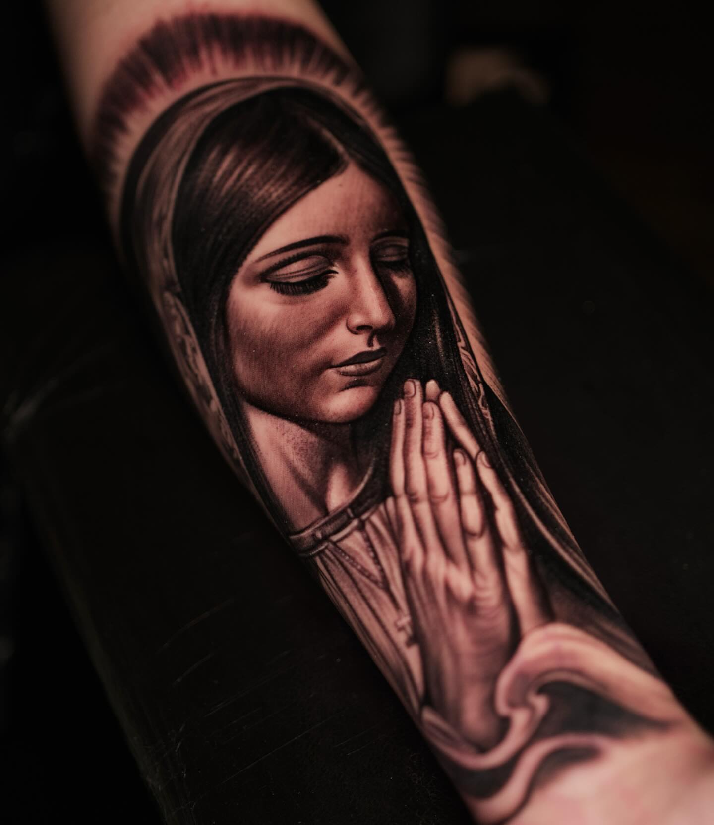 Praying woman realism tattoo on the forearm by Rey Olivares