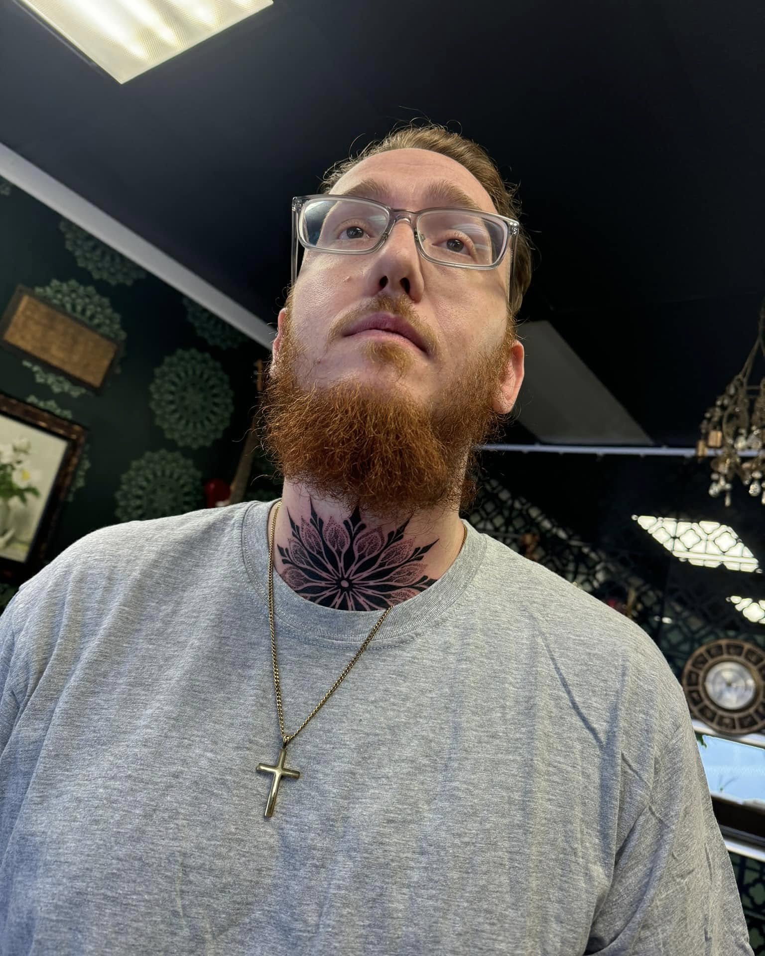 Floral design black and grey tattoo on the neck by Zacharee Osborn