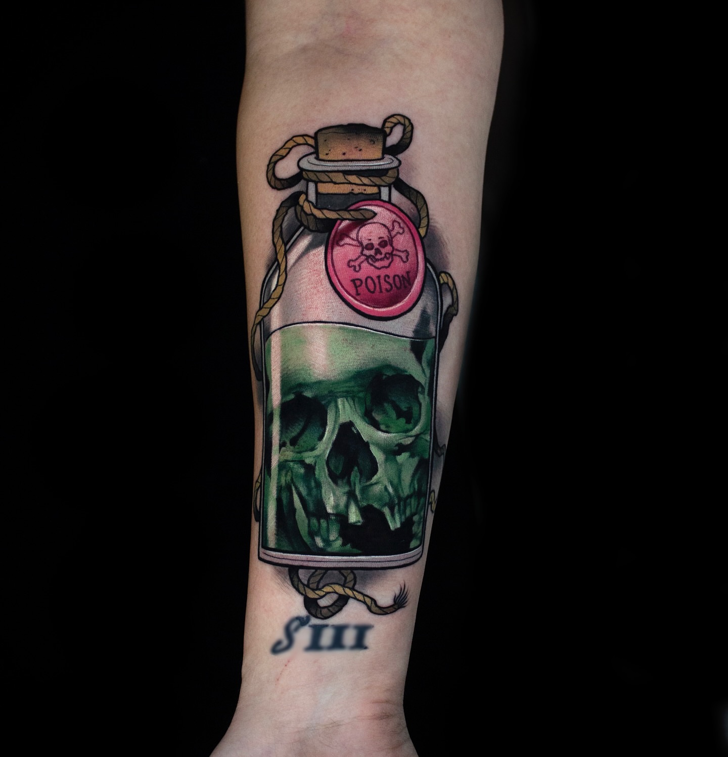 Poison bottle realism tattoo on the forearm by Luke Benavidez