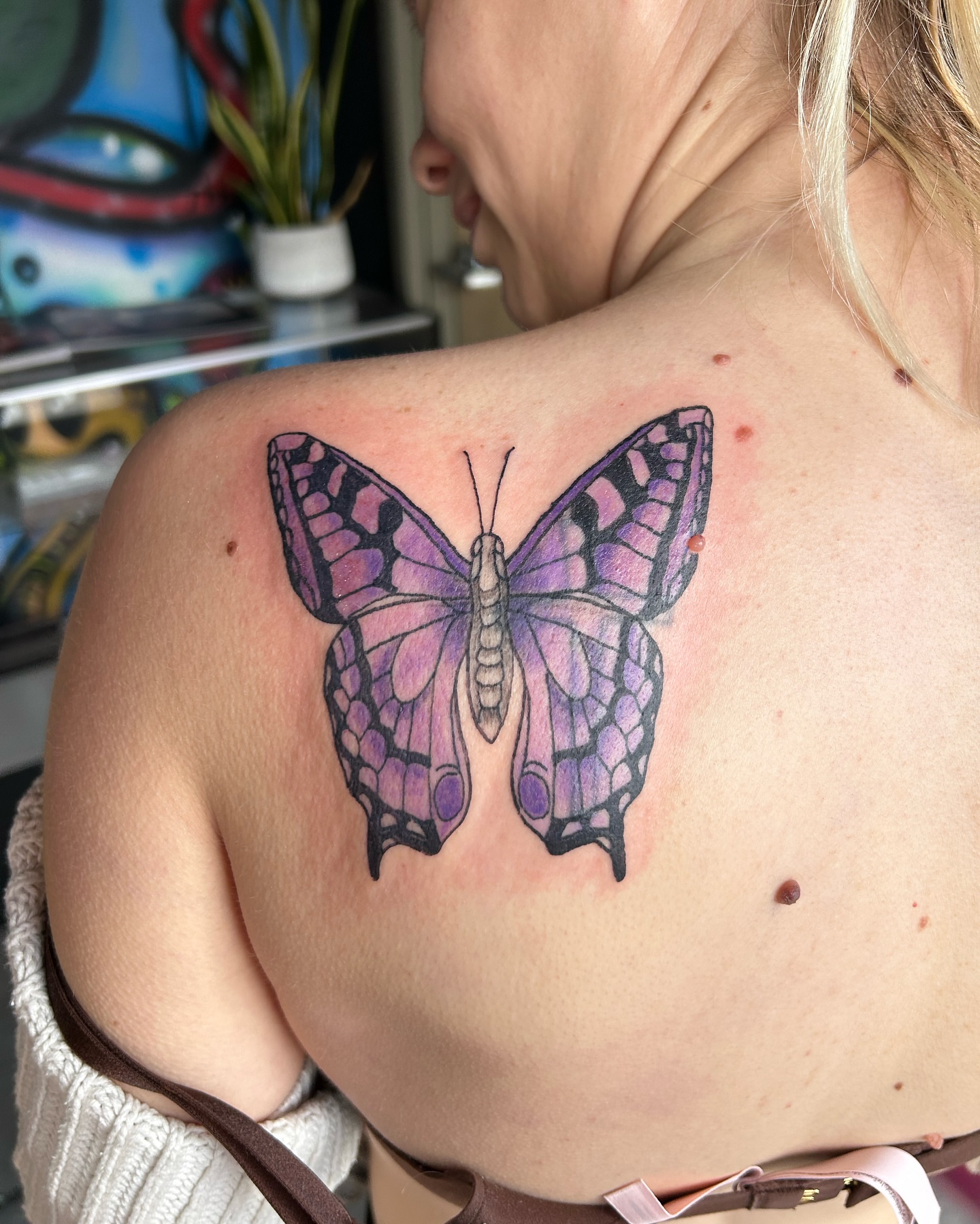 Purple butterfly realism tattoo on the shoulder by goose 🪿