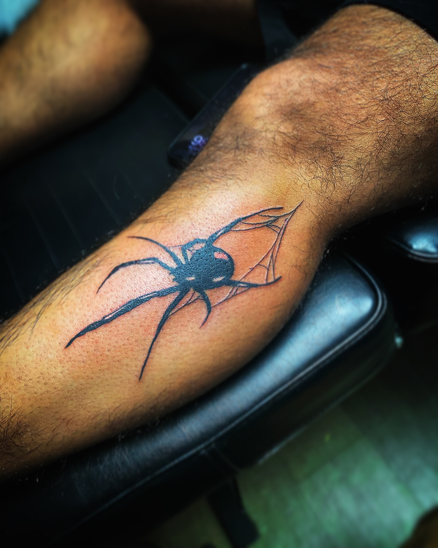 Spider black and grey tattoo on the forearm by Rico Rosario