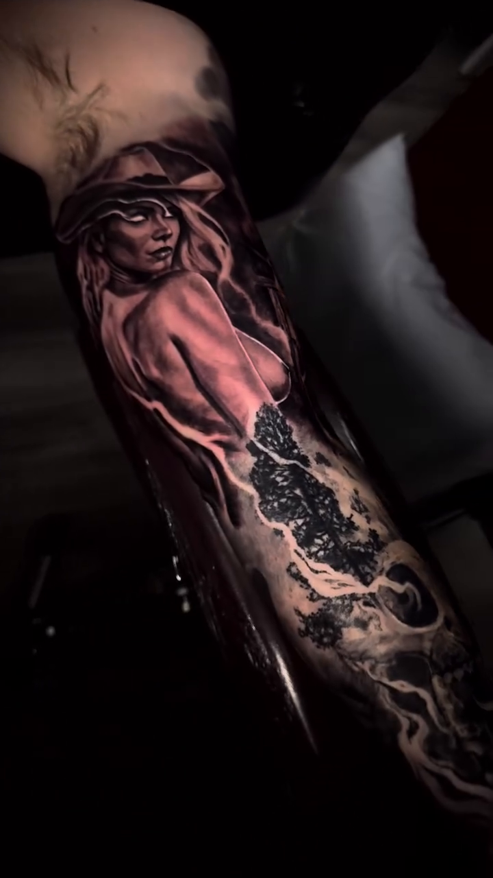 Cowgirl portrait with stormy background realism tattoo by Chuck James, Roseville, California