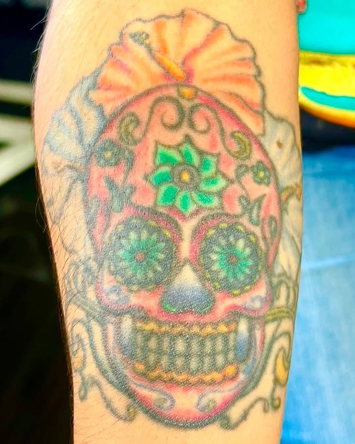 Sugar skull Chicano tattoo on the forearm by Josh Green