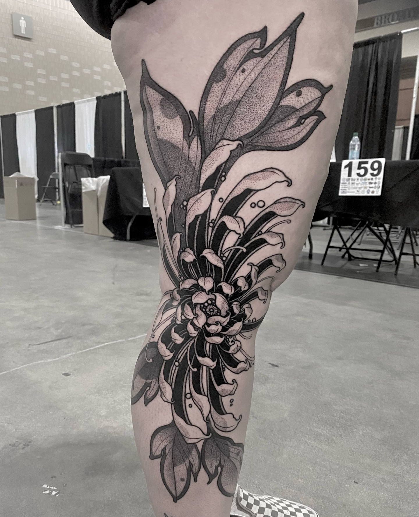 Floral arrangement dotwork tattoo on the thigh by Rowan Starr