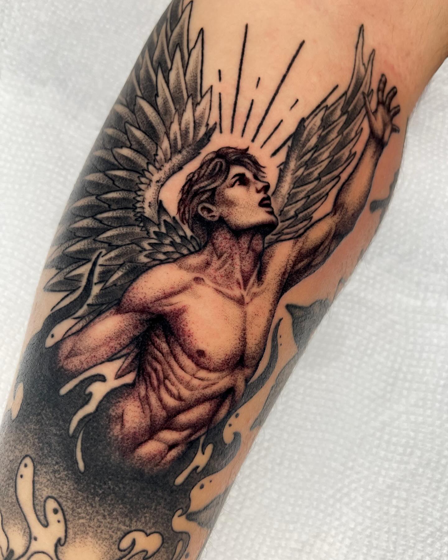Angelic figure realism tattoo on the forearm by Anastasia Vives