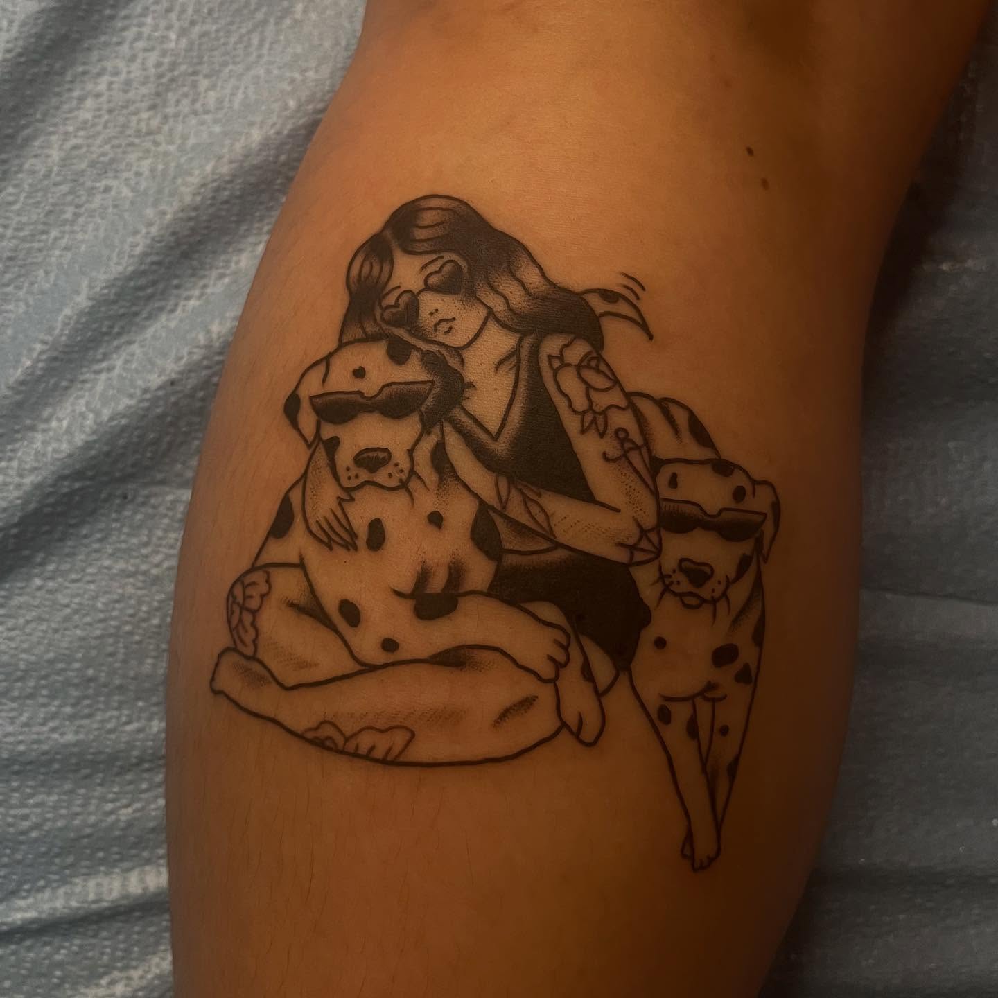 Woman with two dogs dotwork tattoo on the thigh by Mariah Nguyen