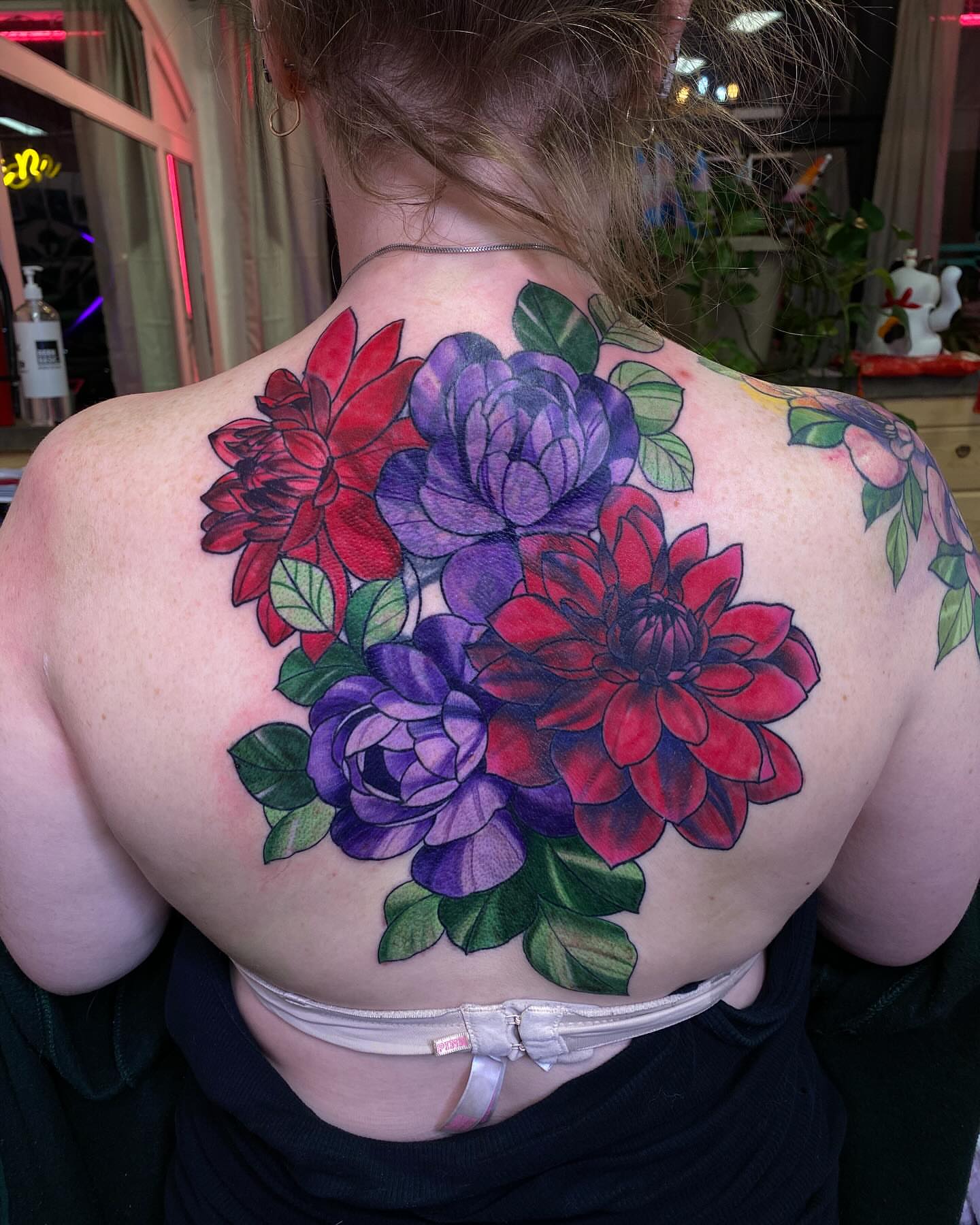 Flower bouquet realism tattoo on the back by @kaitlin.tattoos, Richmond, Virginia