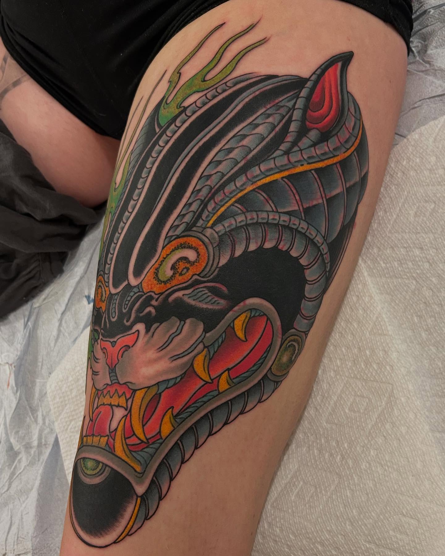 Dragon American traditional tattoo on the thigh by Craig Gardyan