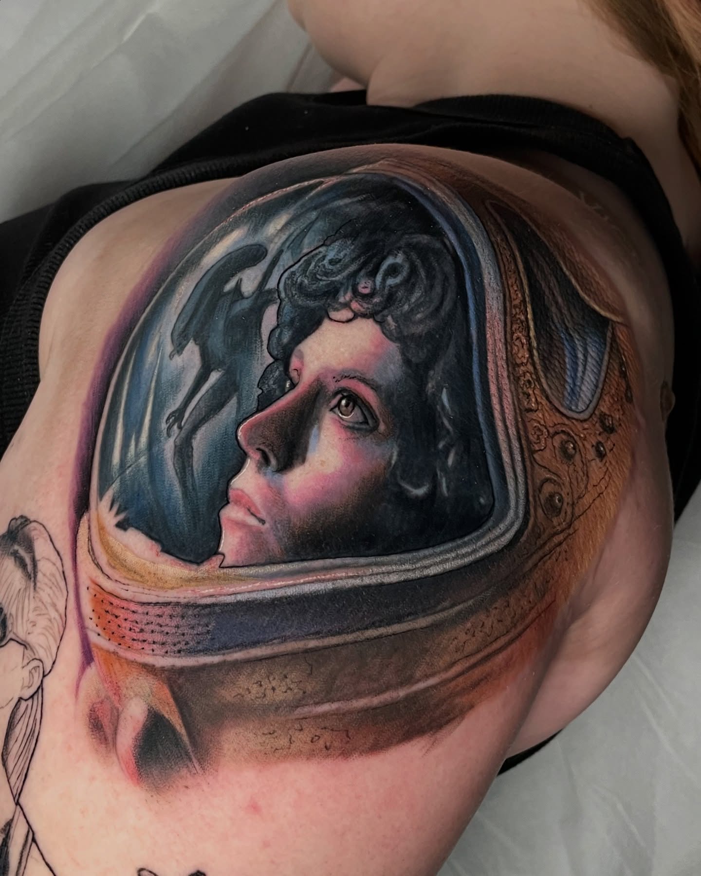 Astronaut portrait realism tattoo on the shoulder by Leah Marie, Cincinnati