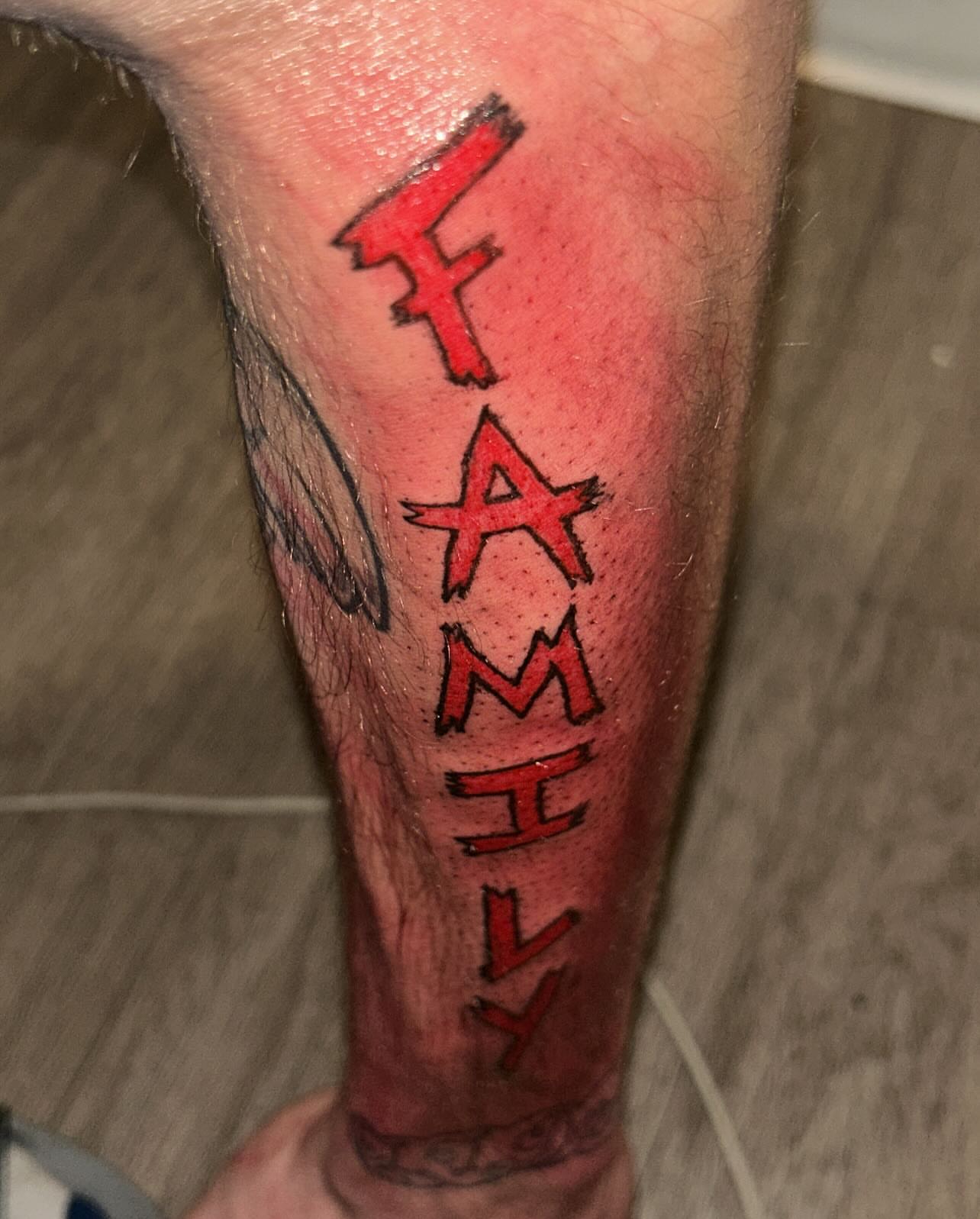 Family lettering script tattoo on the calf by 702tattoo💉🩸