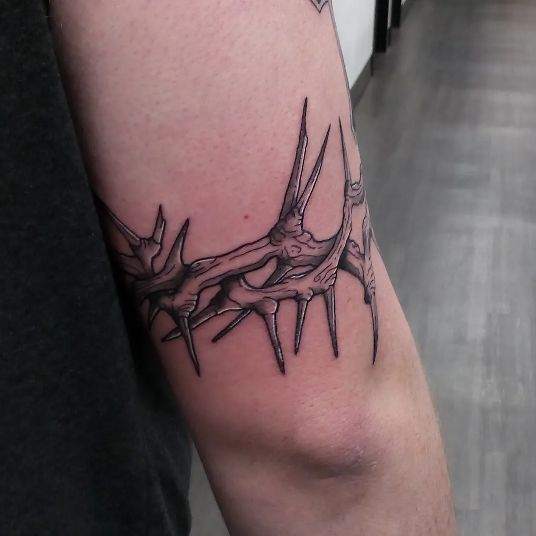 Thorns black and grey tattoo on the forearm by Cassandra Davis