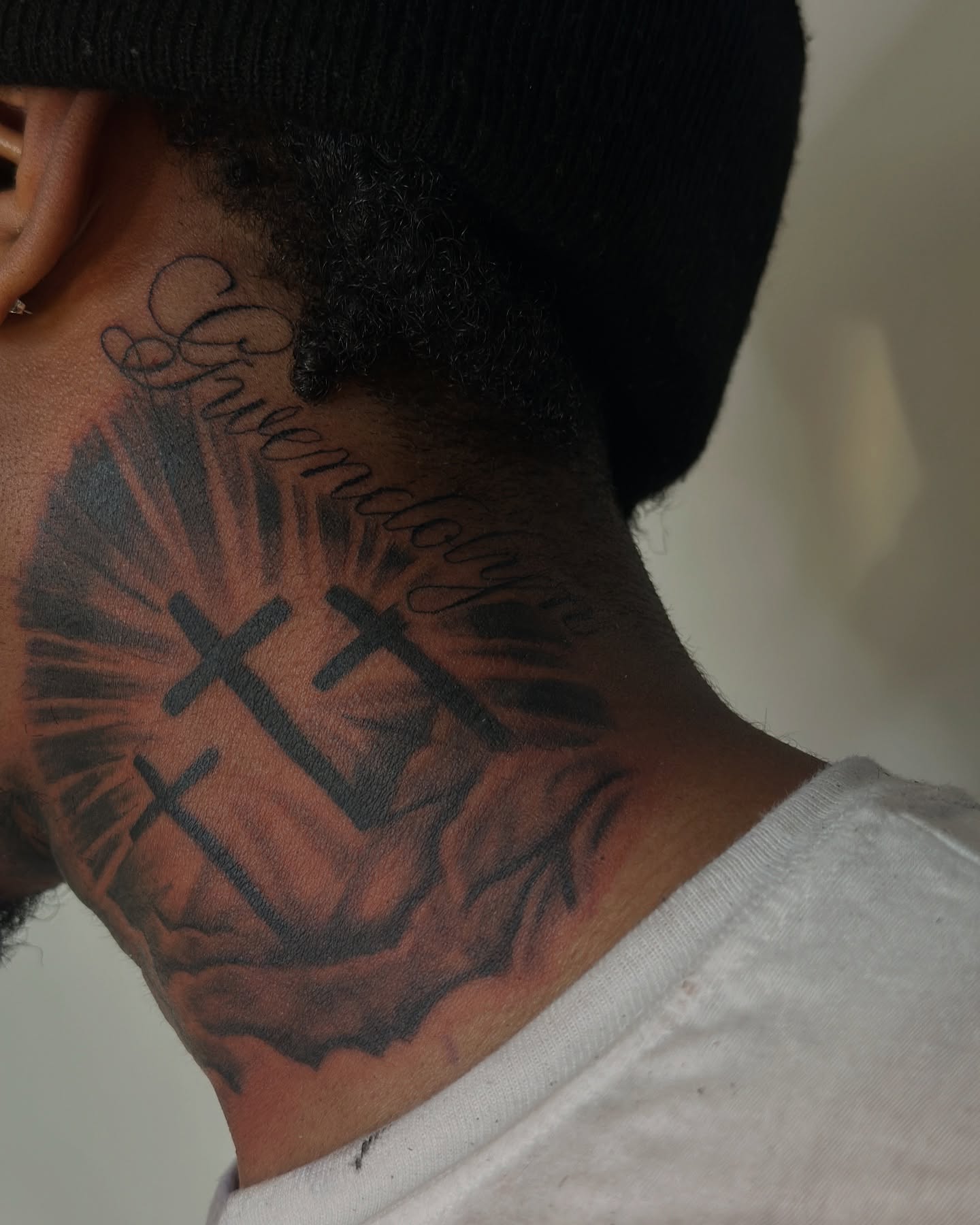 Crosses and script black and grey tattoo on the neck by ᴡᴏʀᴍ