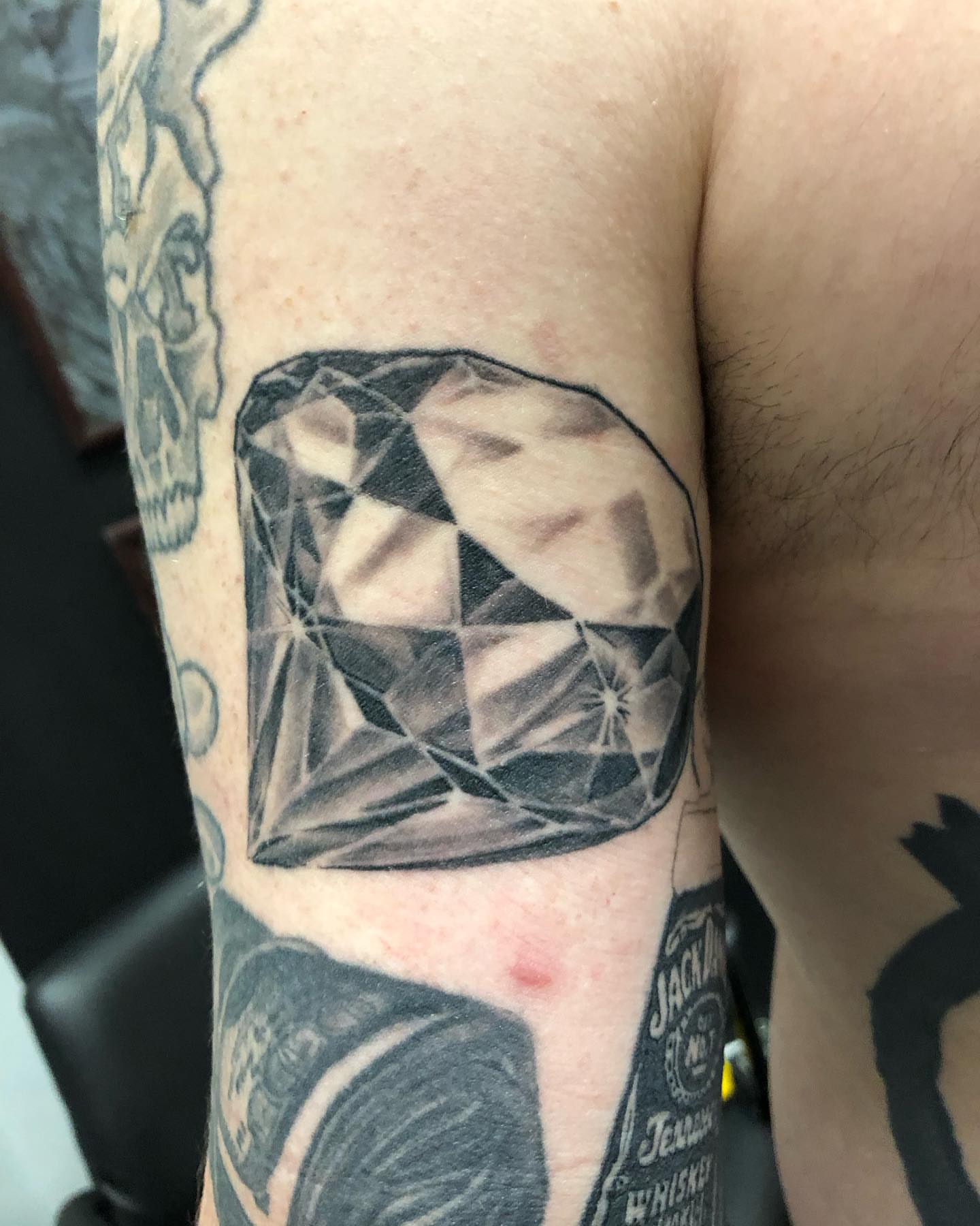 Diamond realism tattoo on the forearm by A.W.