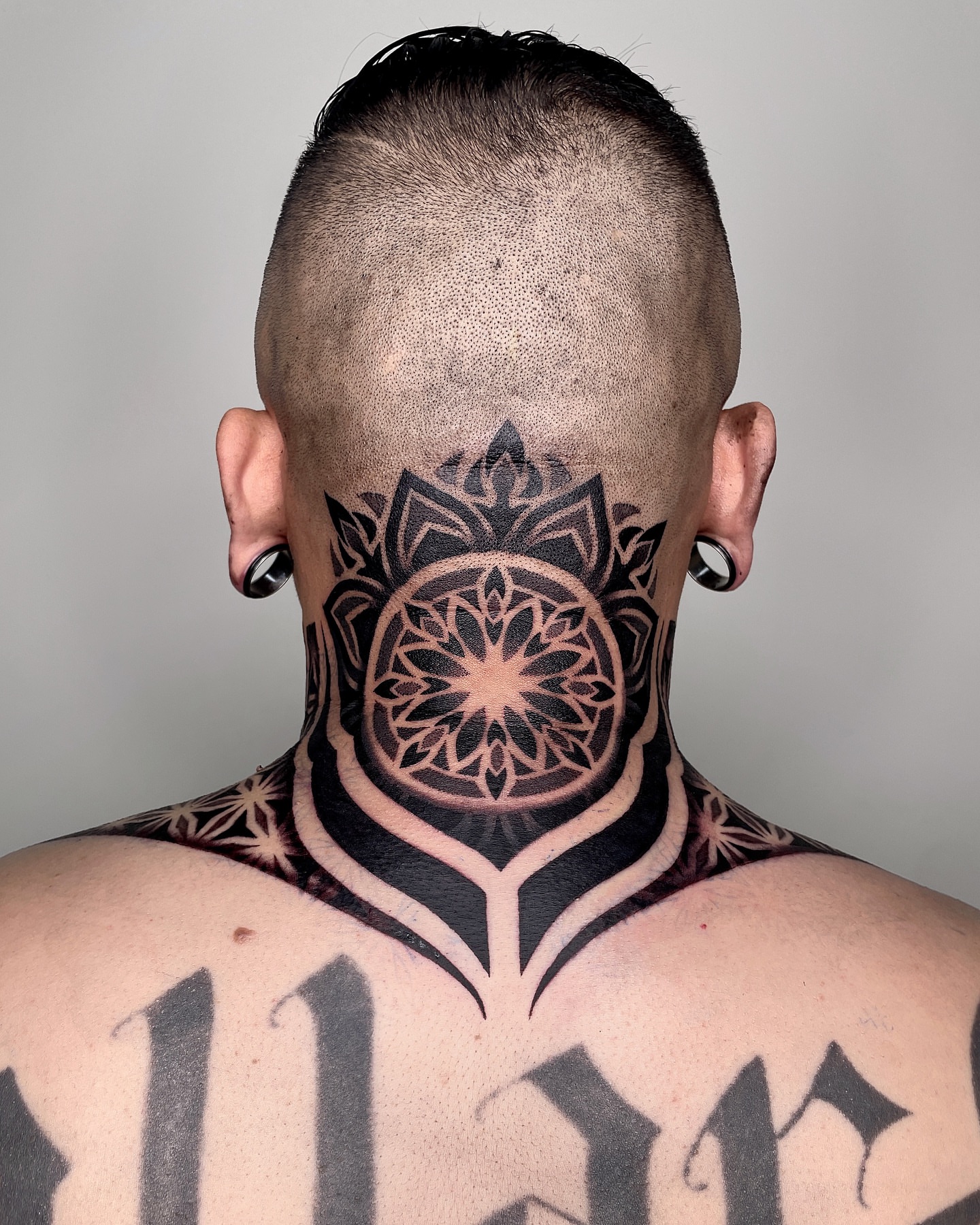 Mandala geometric tattoo on the neck by LA tattoo