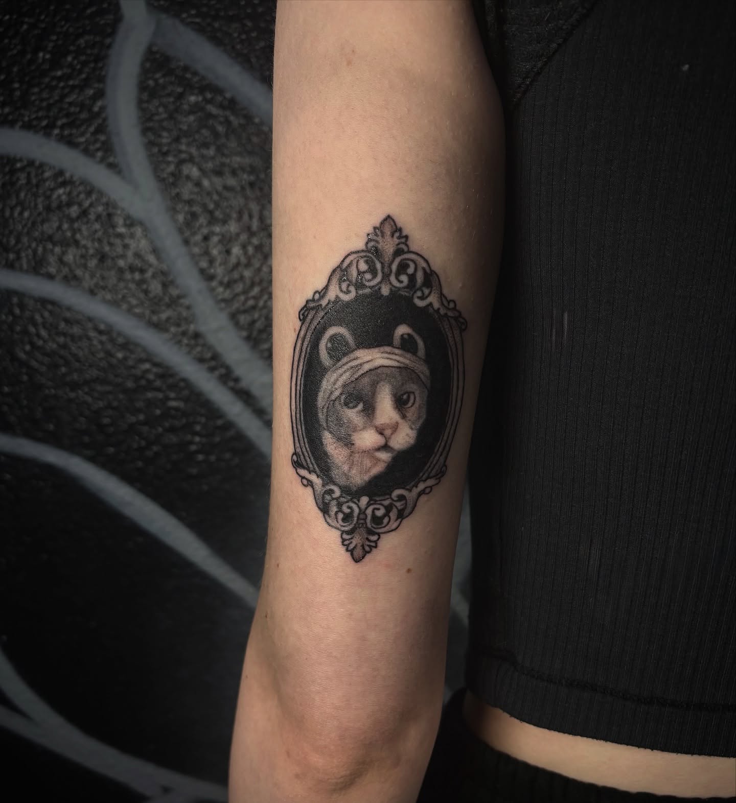 Cat in ornate frame realism tattoo on the forearm by Love 🥀 222
