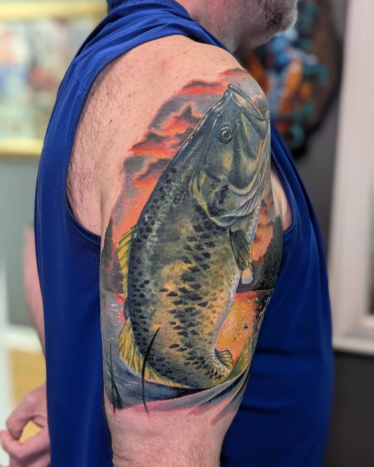 Fish realism tattoo on the upper arm by Bethany Jane Tattoos