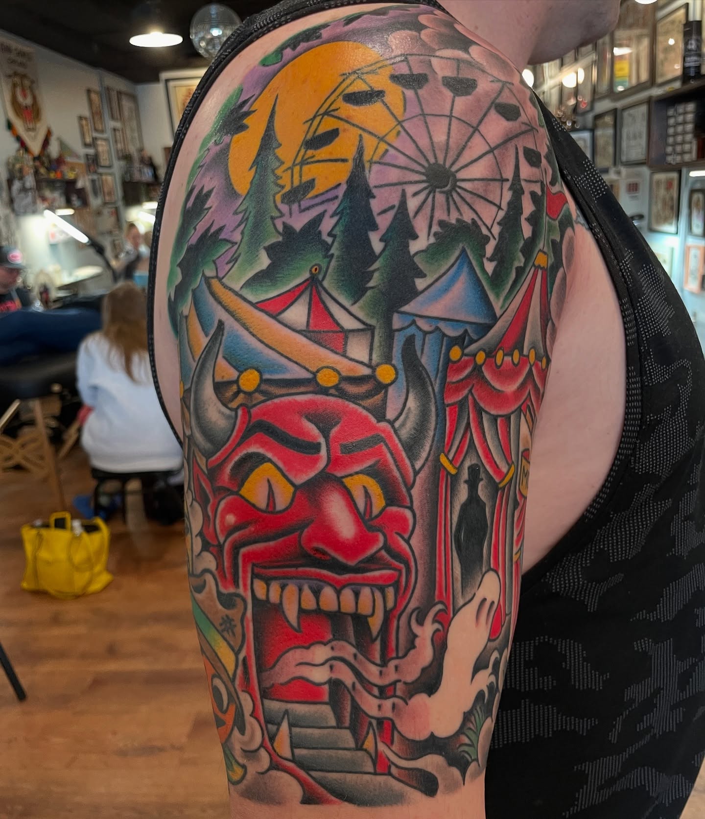 Demon face American traditional tattoo on the upper arm by Grandma Approved, Chicago, Illinois