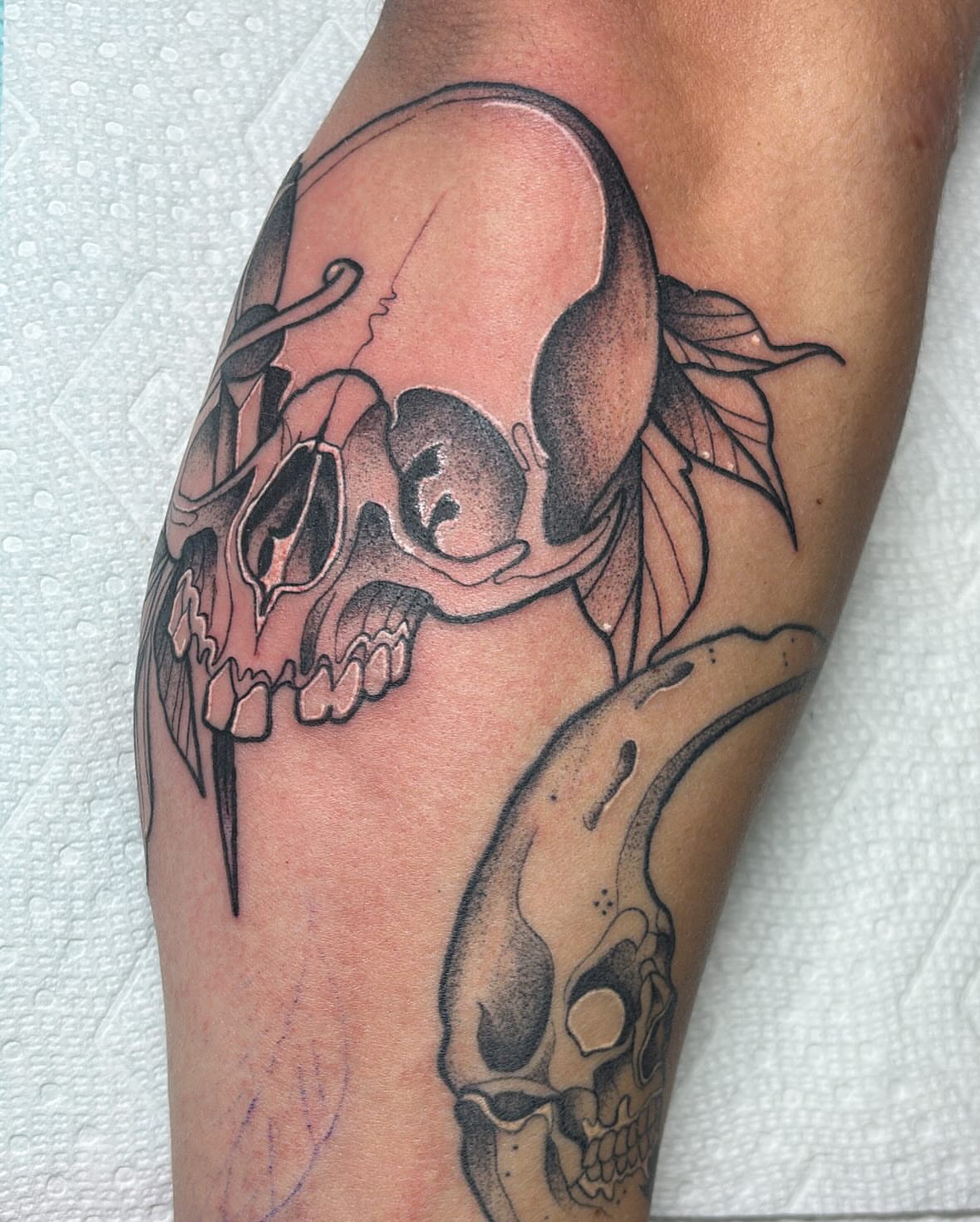 Skull black and grey tattoo on the forearm by Edward A. Boesch