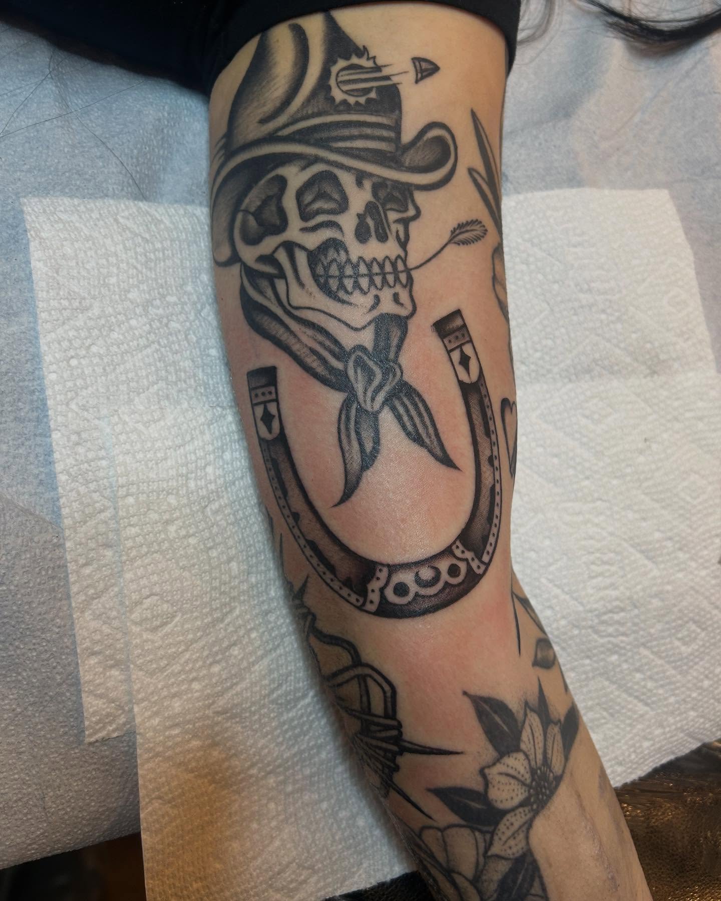 Skull with cowboy hat American traditional tattoo on the forearm by Sam Perry, Denver, Colorado