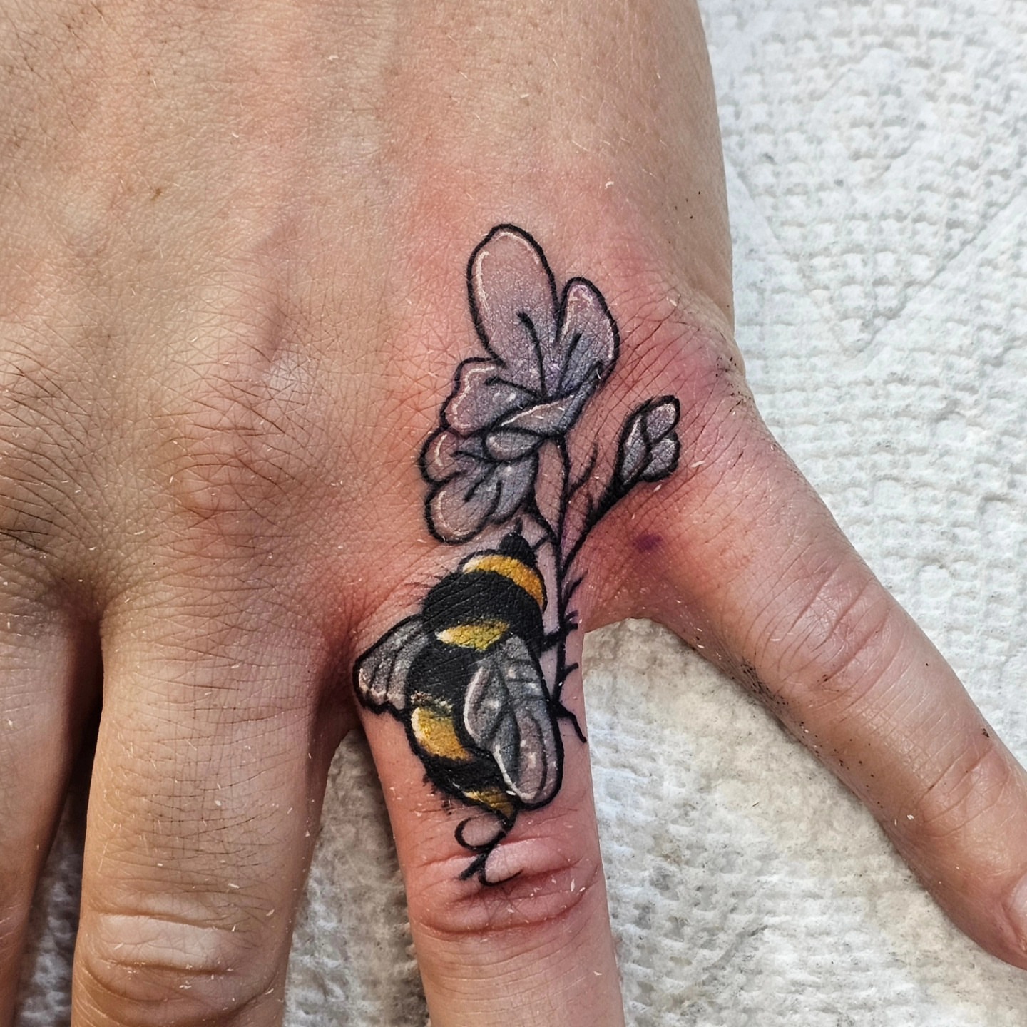Bee and flower realism tattoo on the hand by BZ Artistry