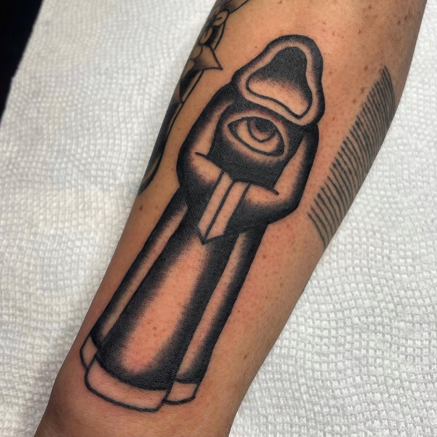 Gun black and grey tattoo on the forearm by nancy❣️