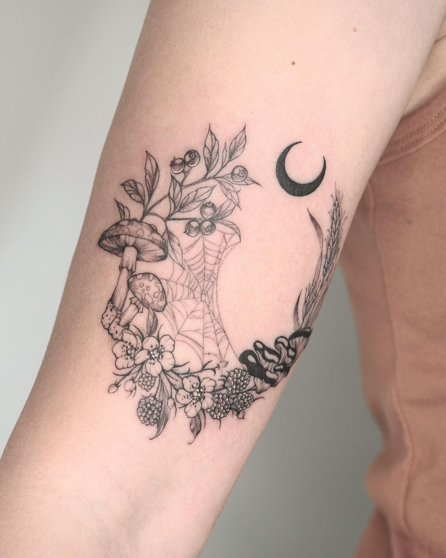 Mushrooms, flowers, moon realism tattoo on the forearm by Marianna D D King