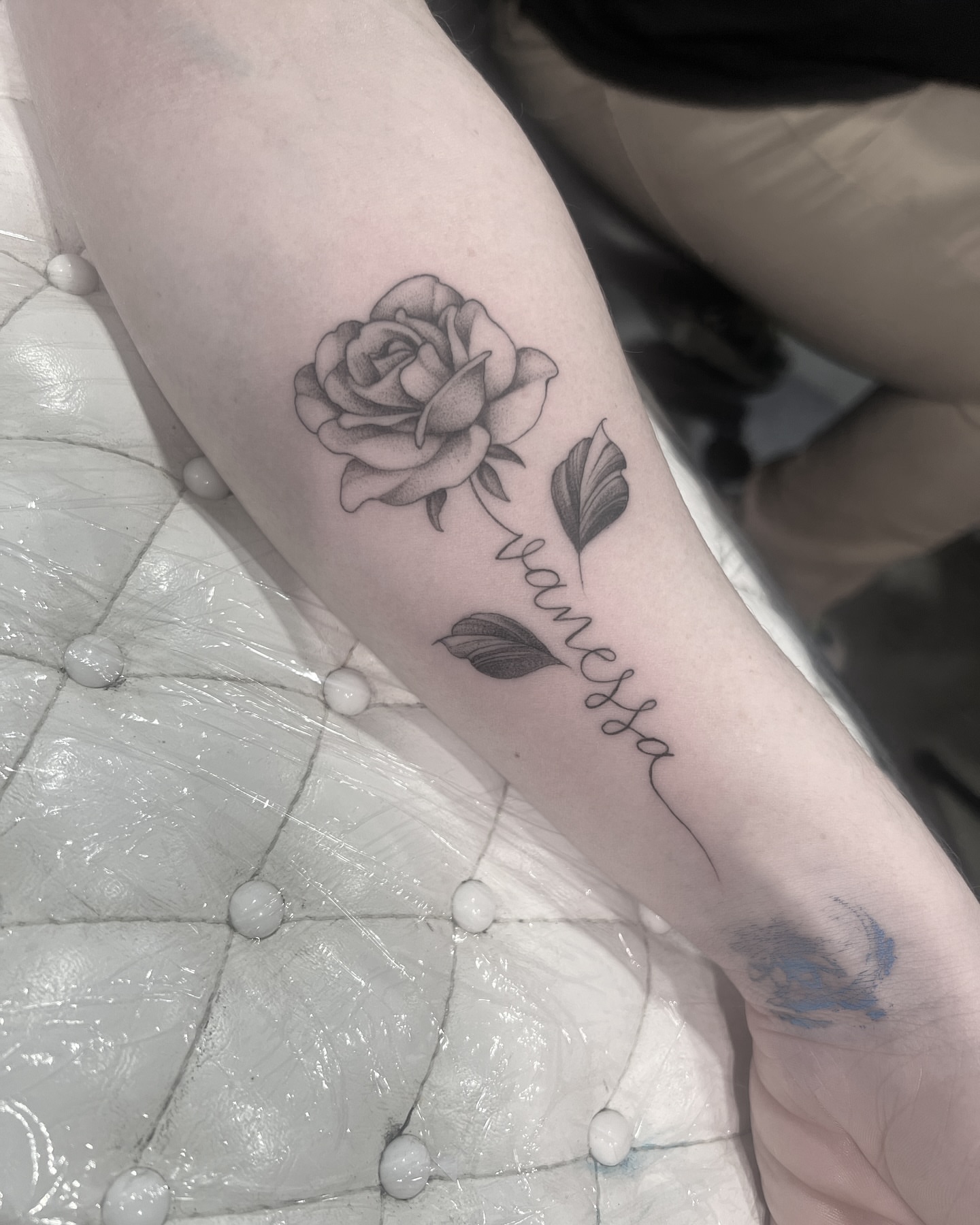 Rose black and grey tattoo on the forearm by Chelsea Speirs