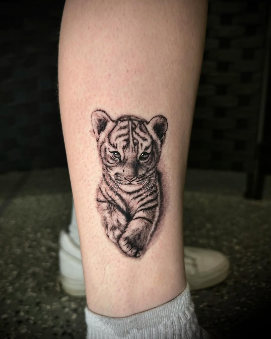 Baby tiger realism tattoo on the forearm by oh hey, robin.