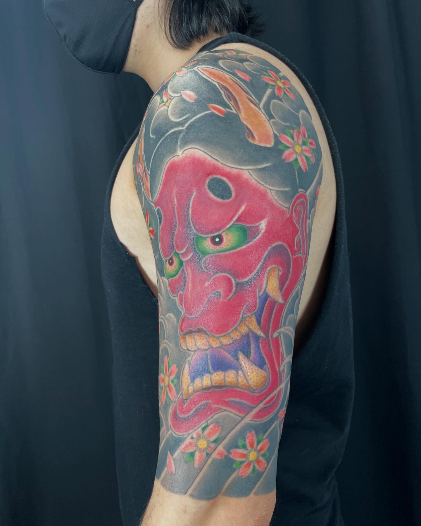 Demon mask japanese irezumi tattoo on the upper arm by Ei Horimiya Omiya