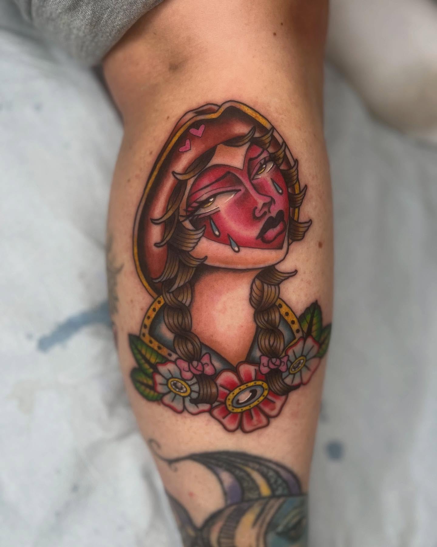 Woman's face American traditional tattoo on the forearm by Mika Clairissa