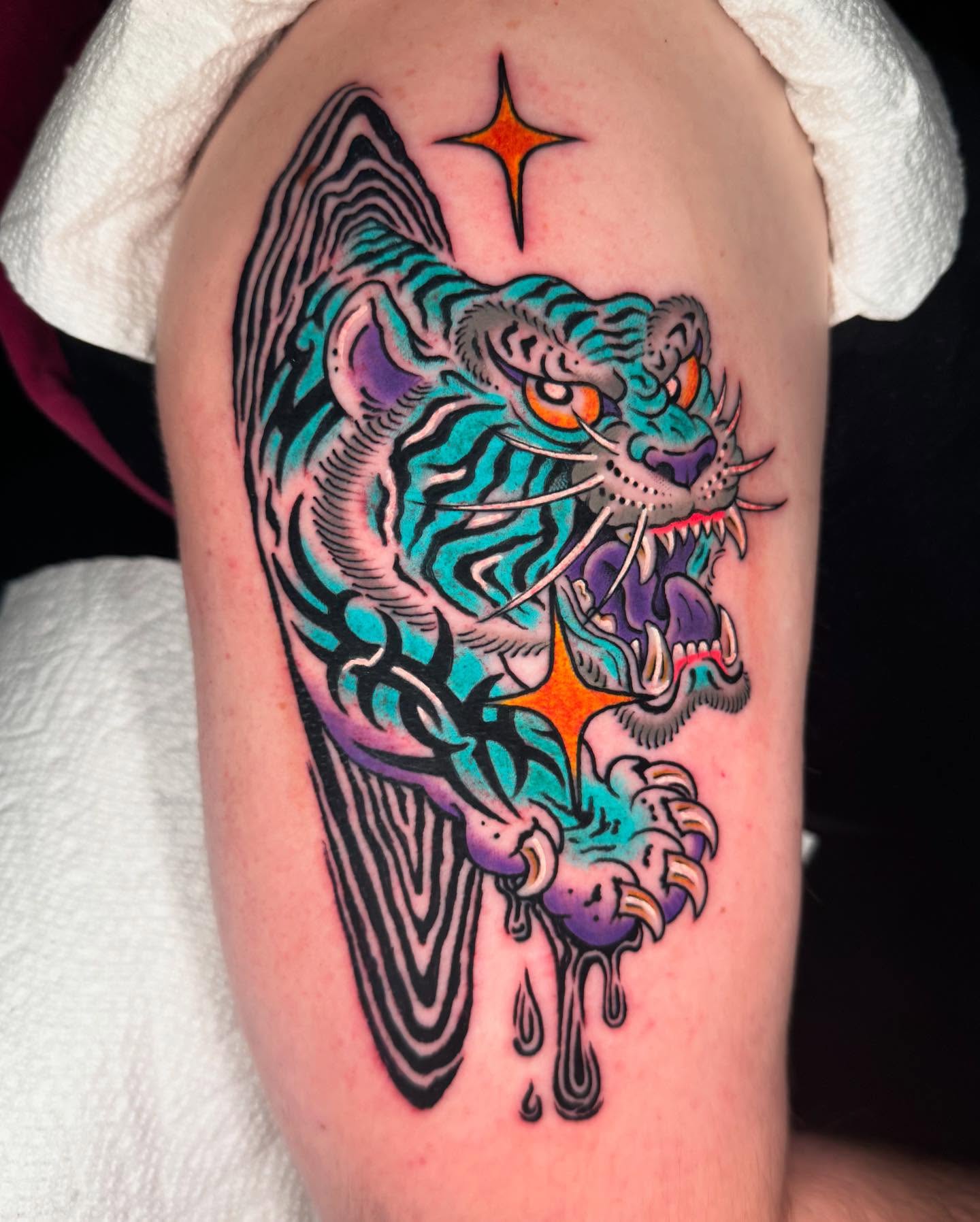 Tiger American traditional tattoo on the forearm by Graham Edward Vogel