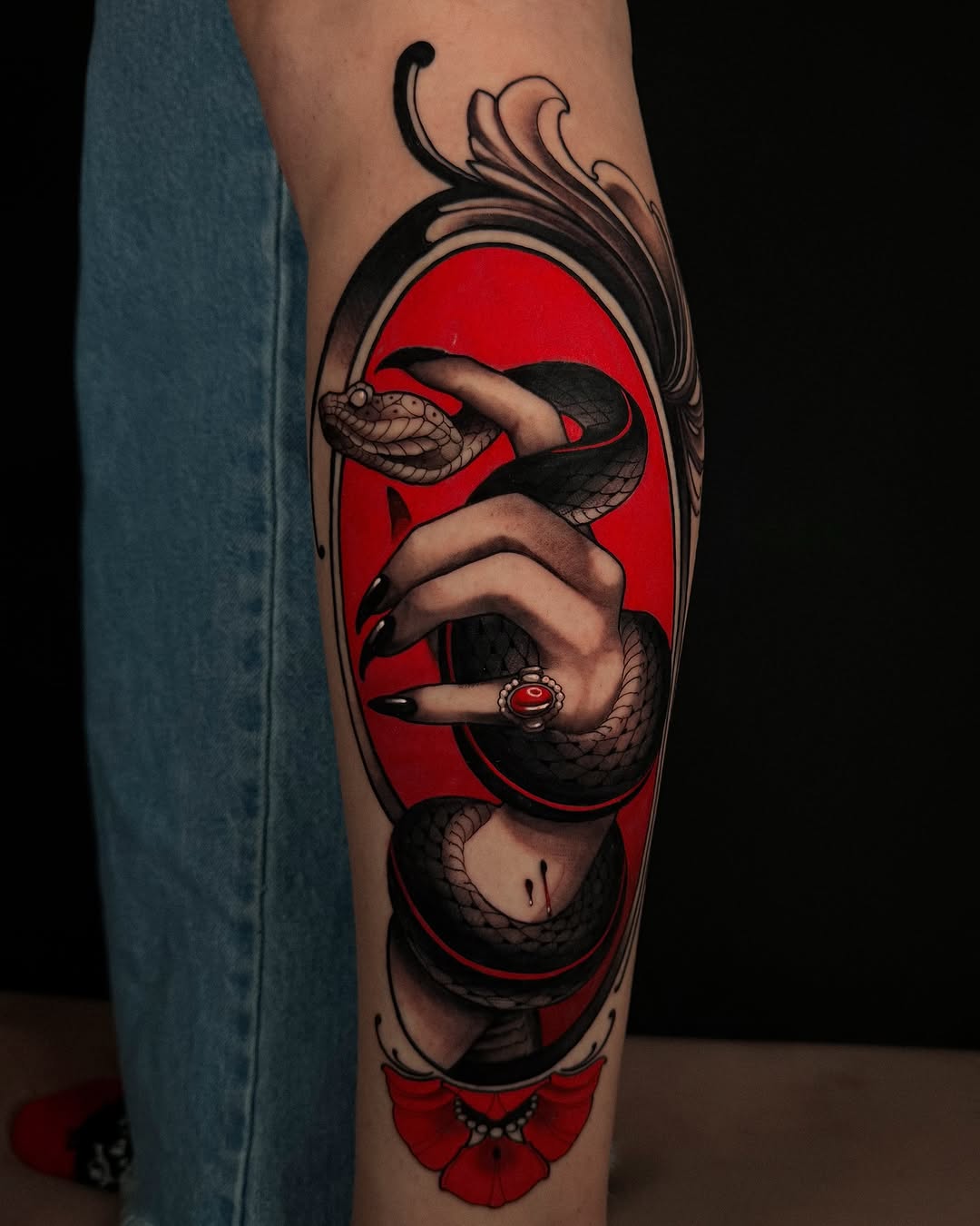 Snake and hand in frame American traditional tattoo on the forearm by Carlos Valdes ✨ Tattoo Artist in Tampa FL