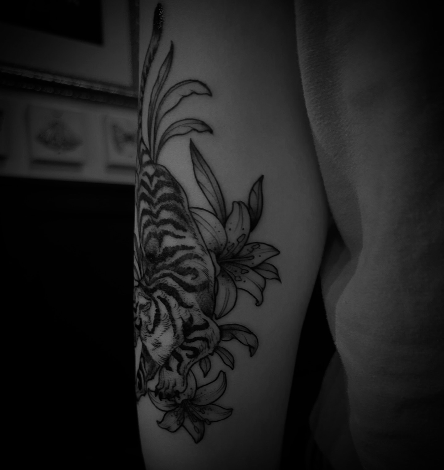 Tiger and lilies realism tattoo on the forearm by Desireé Keys, Midvale, Utah